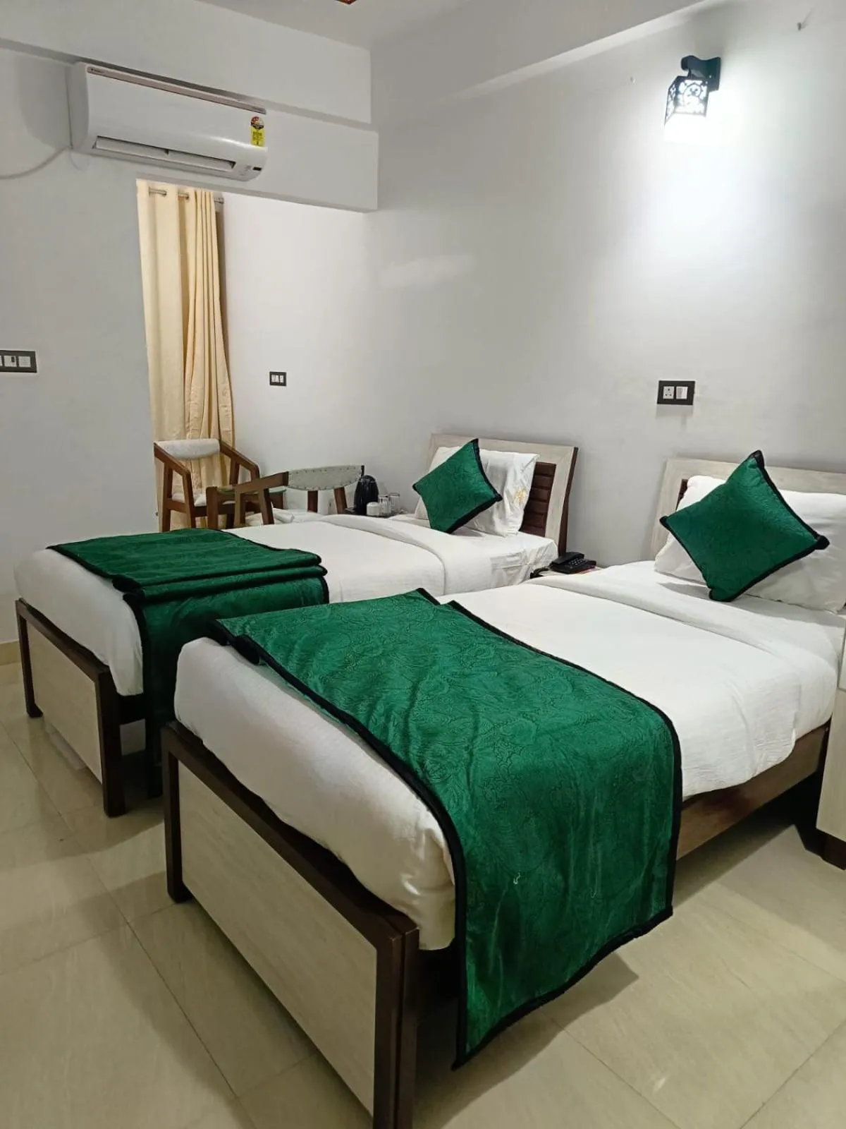 Bed in Hotel Aman Residency