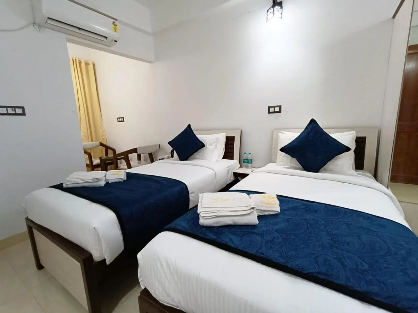 Bed in Hotel Aman Residency