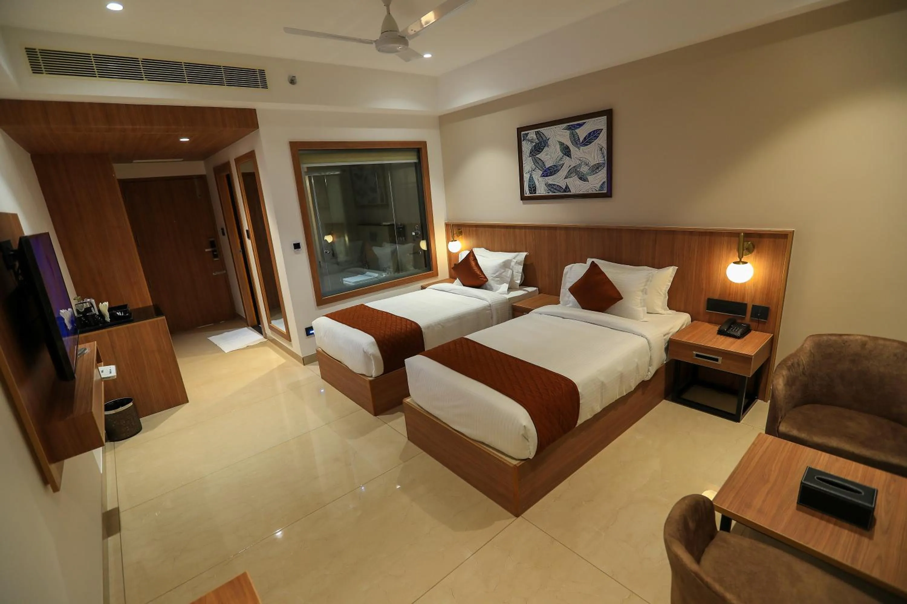 Bed in Hotel Saffron Wayanad