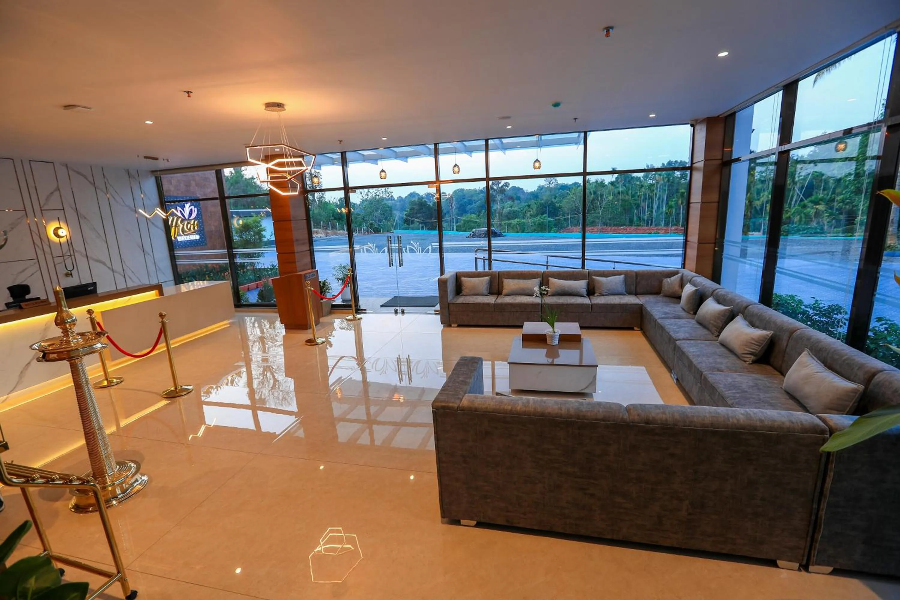 Communal lounge/ TV room in Hotel Saffron Wayanad