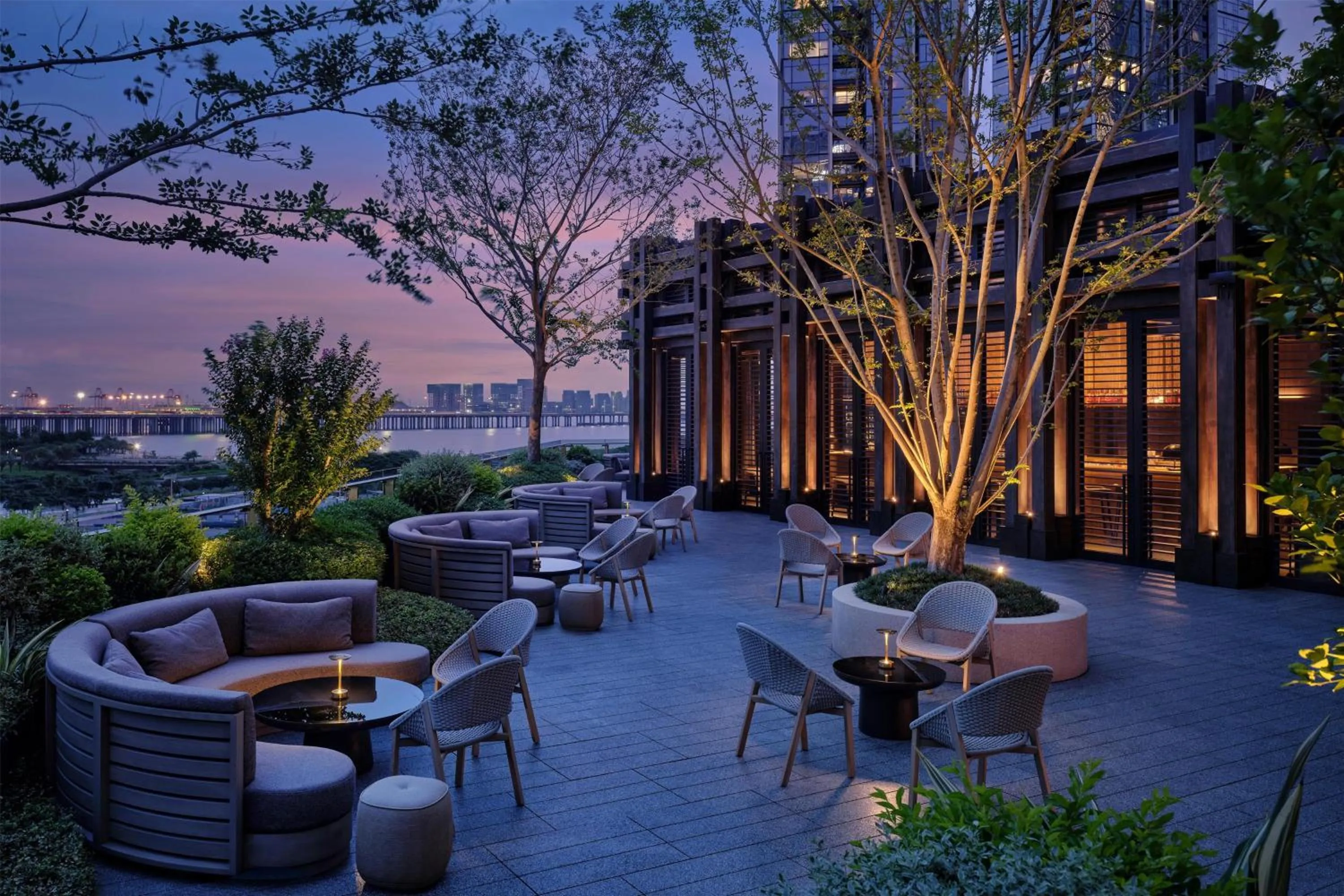 Lounge or bar in Conrad Shenzhen, the first art museum hotel in Greater Bay Area with the stunning bay and sunset view in the hotel terrace