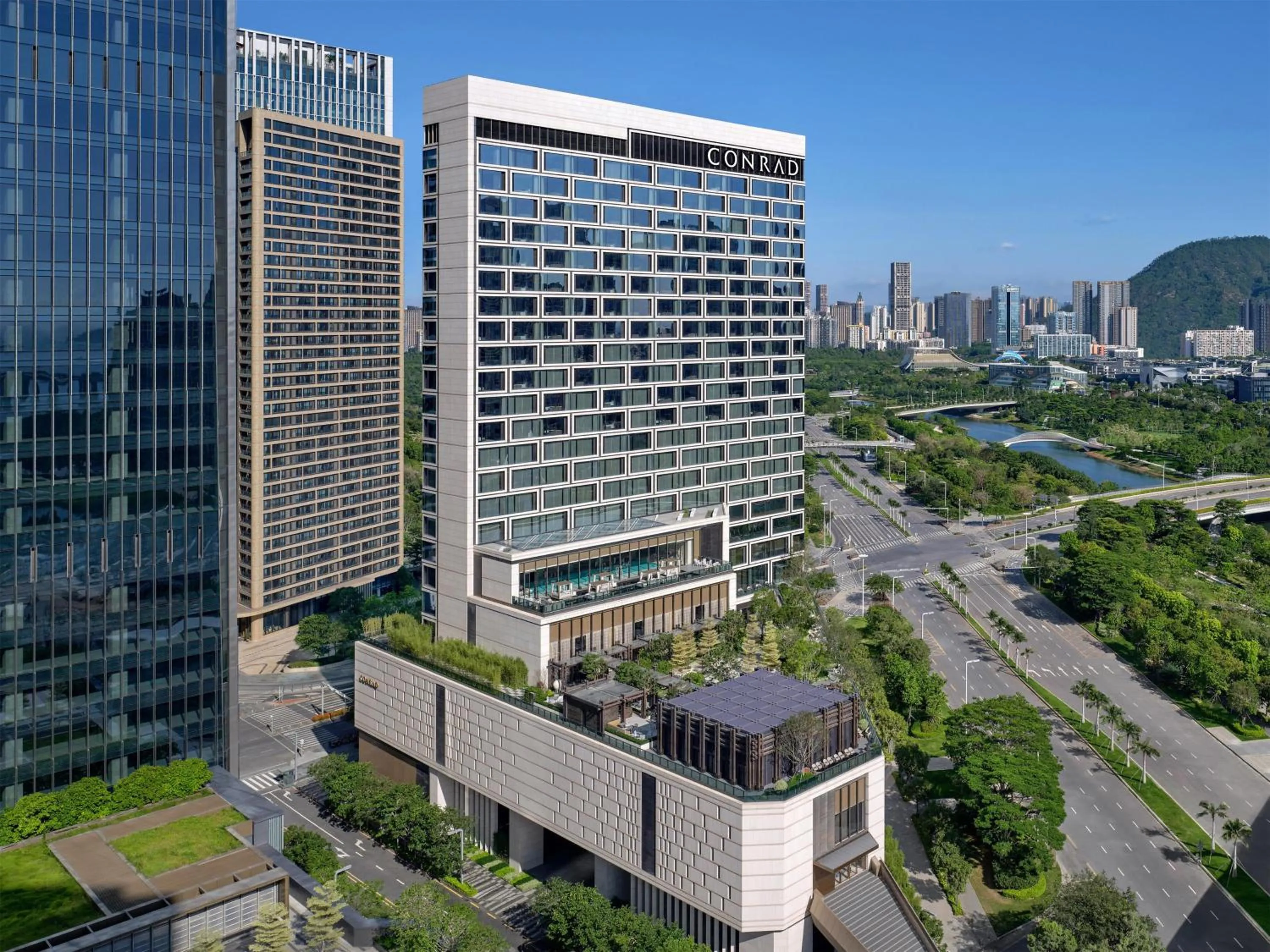 Property building in Conrad Shenzhen, the first art museum hotel in Greater Bay Area with the stunning bay and sunset view in the hotel terrace