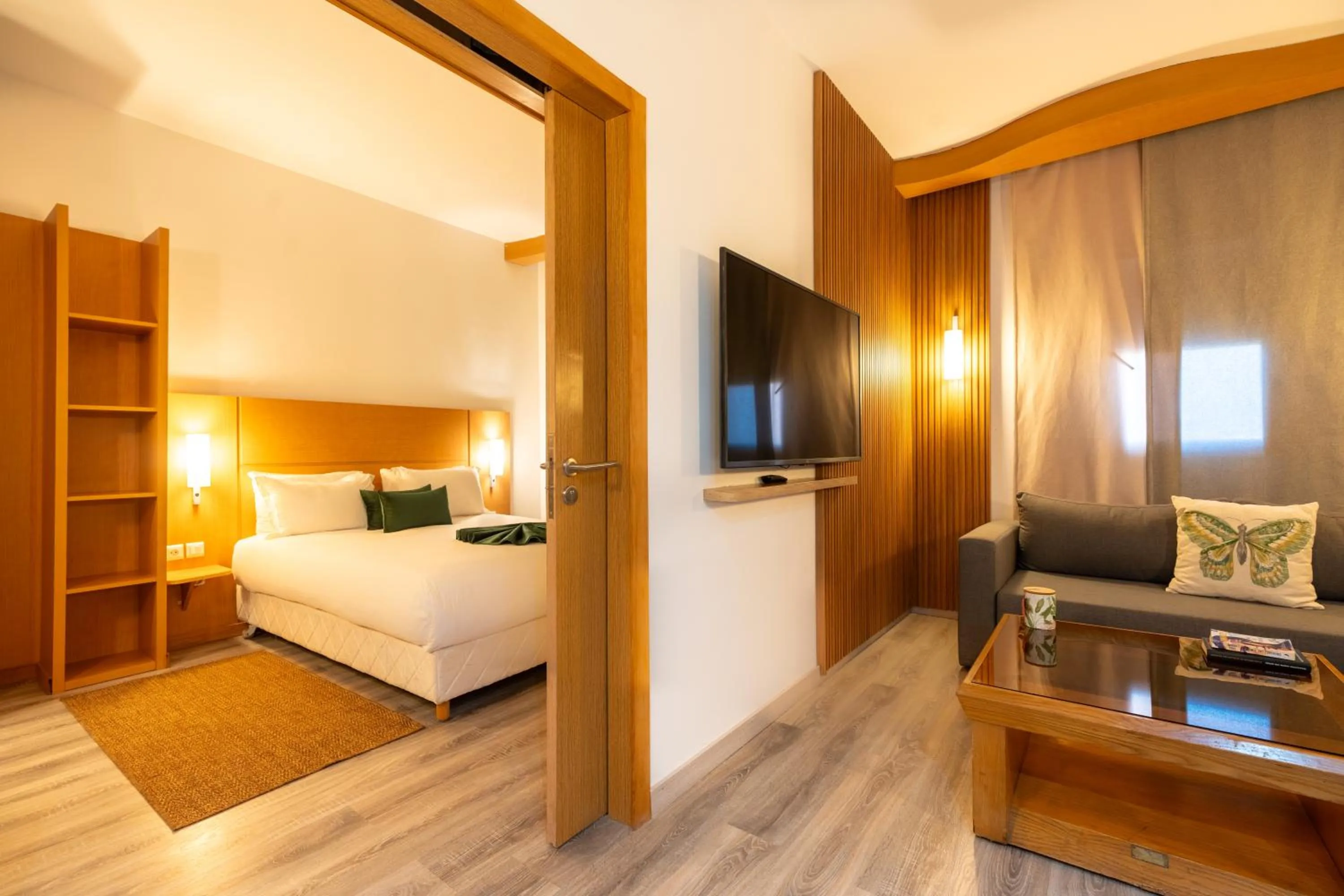 Communal lounge/ TV room, Bed in Hôtel La Perle de Mogador