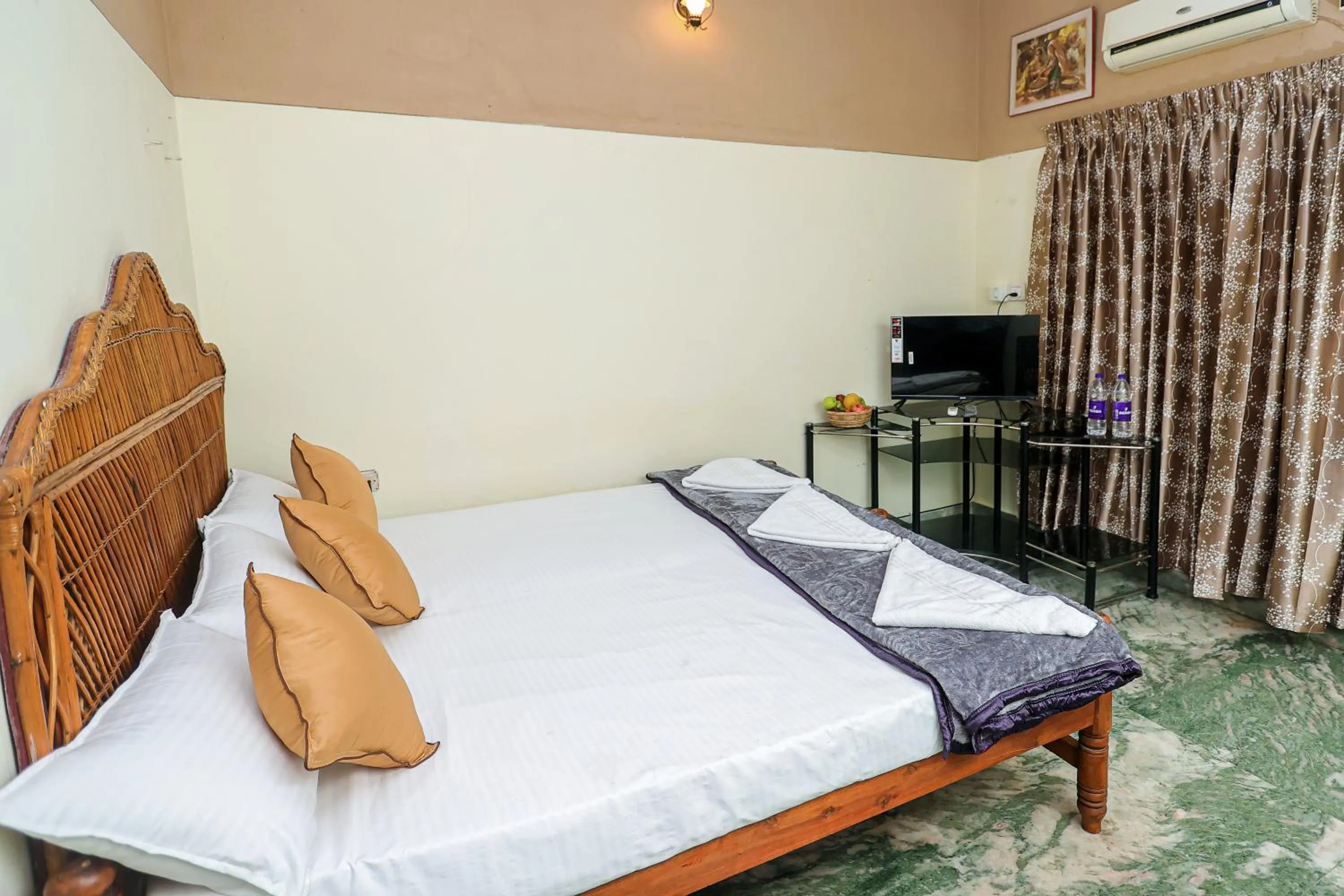 Bed in NALINAM HOMESTAY
