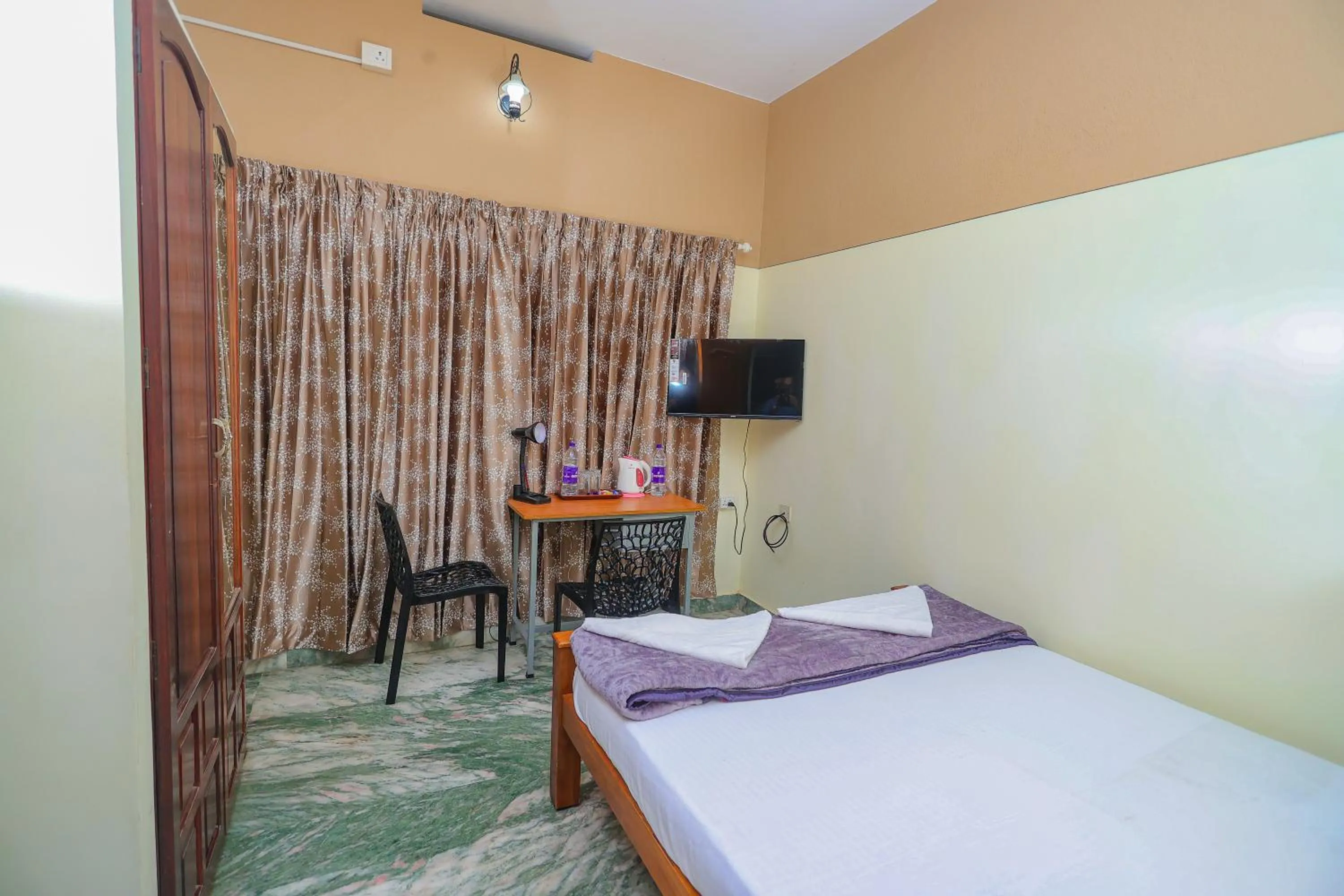 Bed in NALINAM HOMESTAY