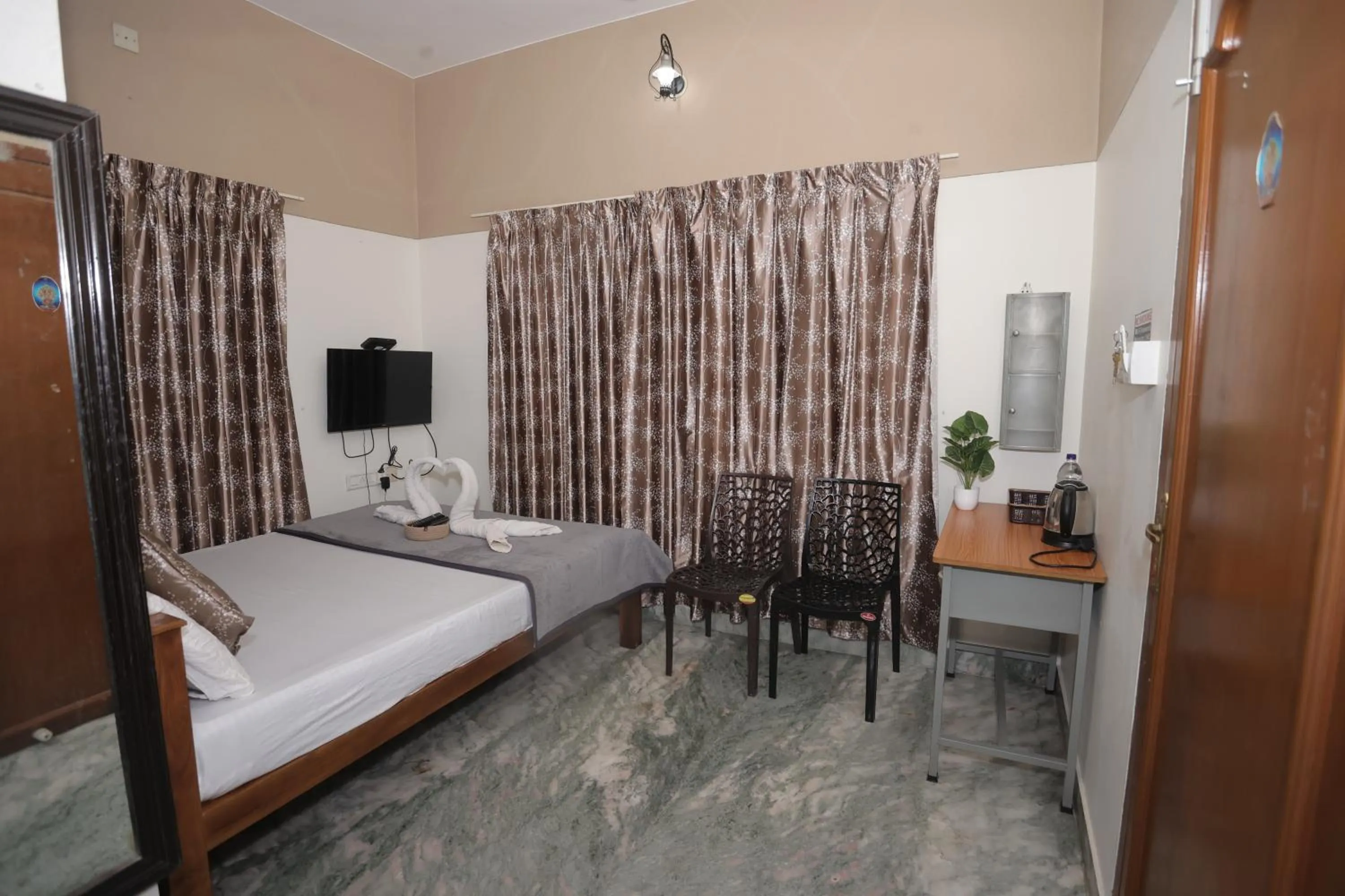 Bed in NALINAM HOMESTAY