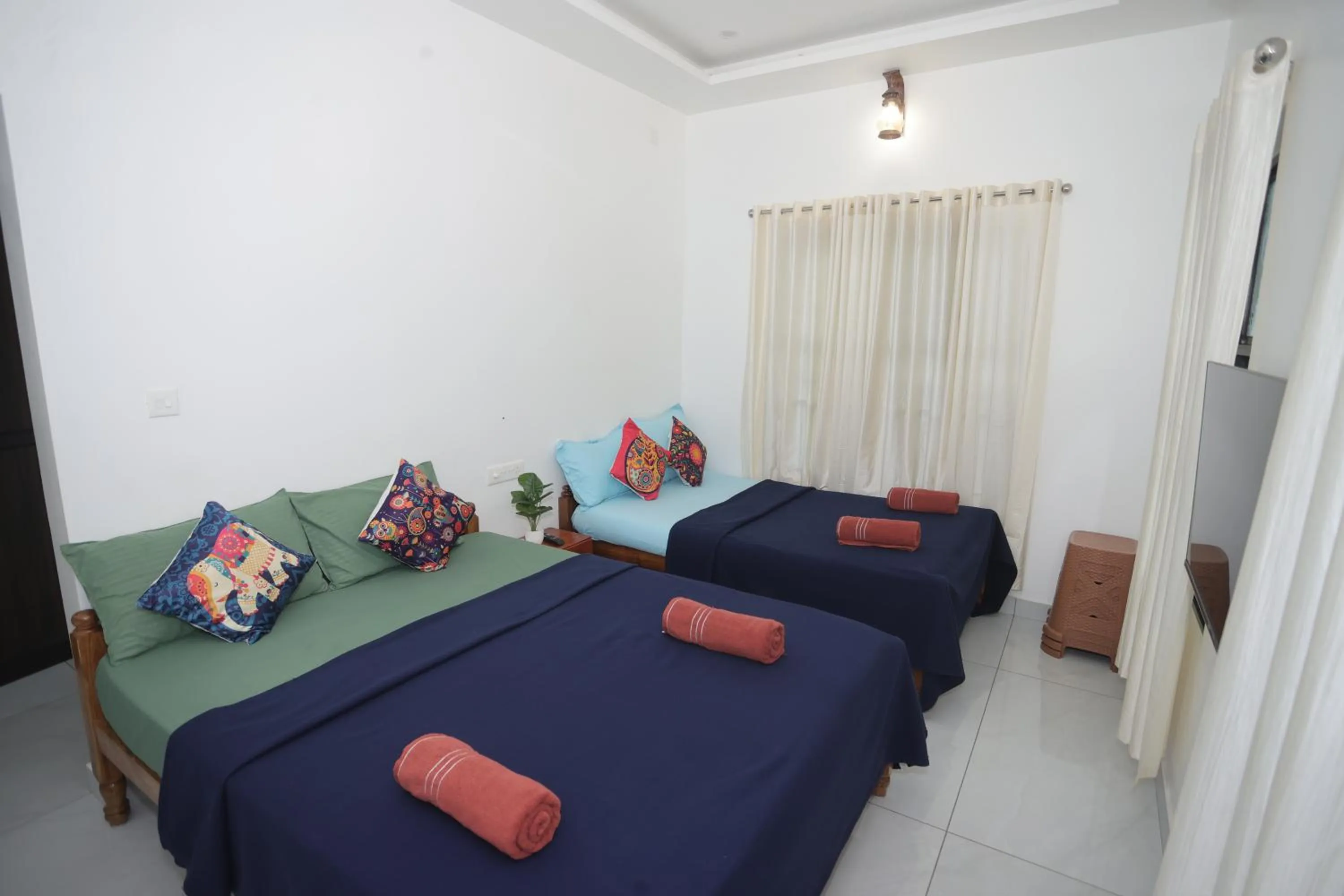 Bed in NALINAM HOMESTAY