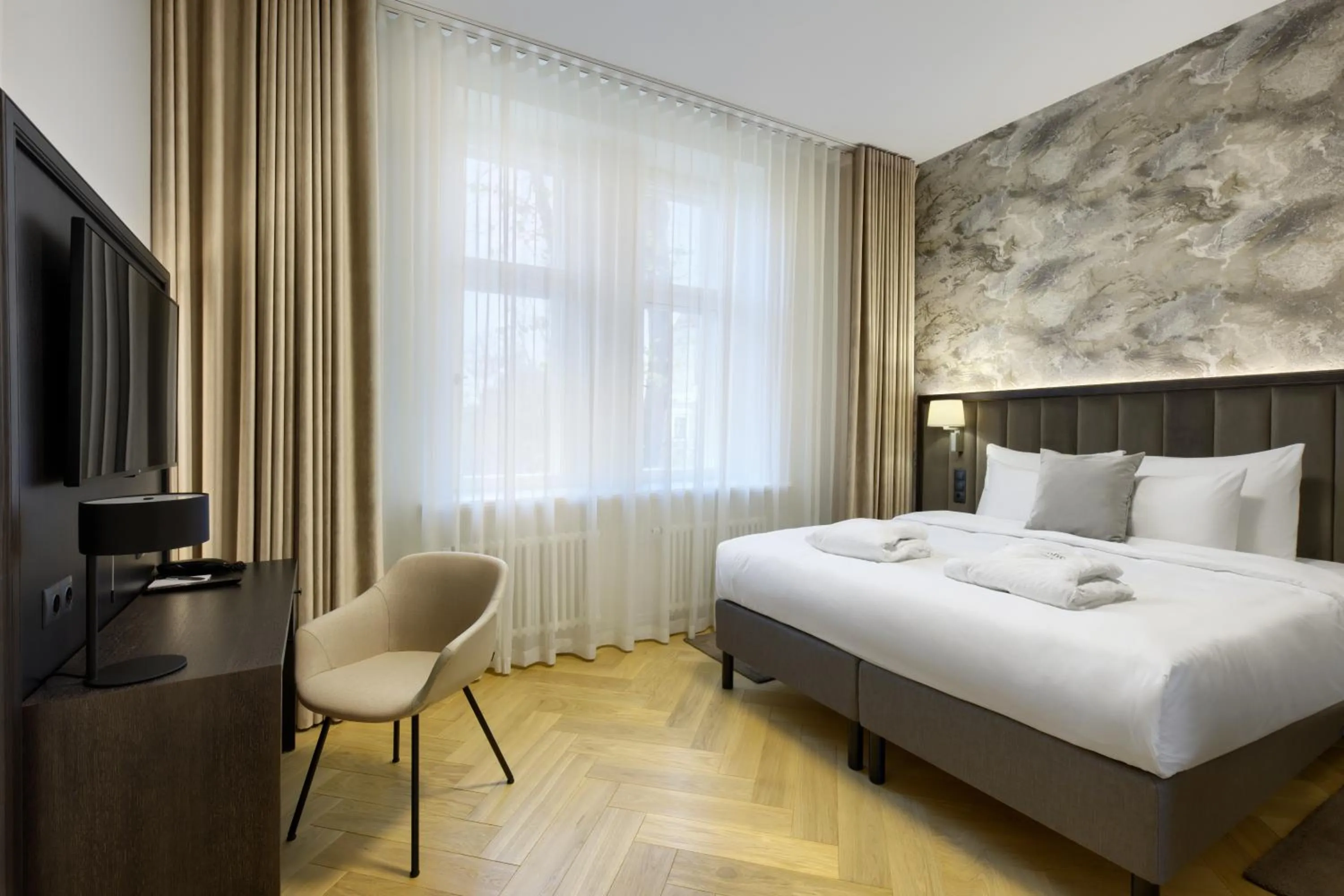 Bed in Nunne Boutique Hotel