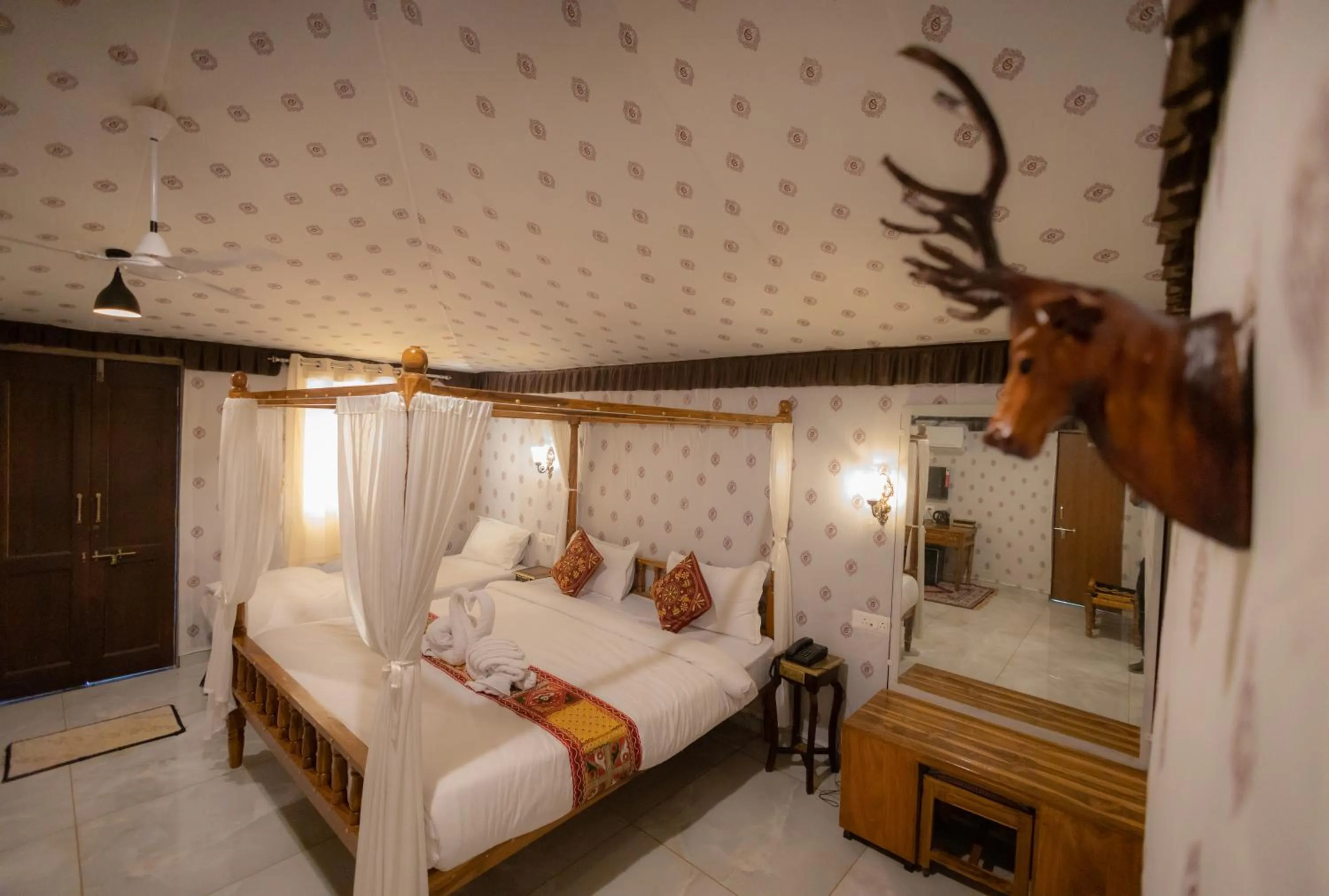 Bed in Vasant Vihar Resort