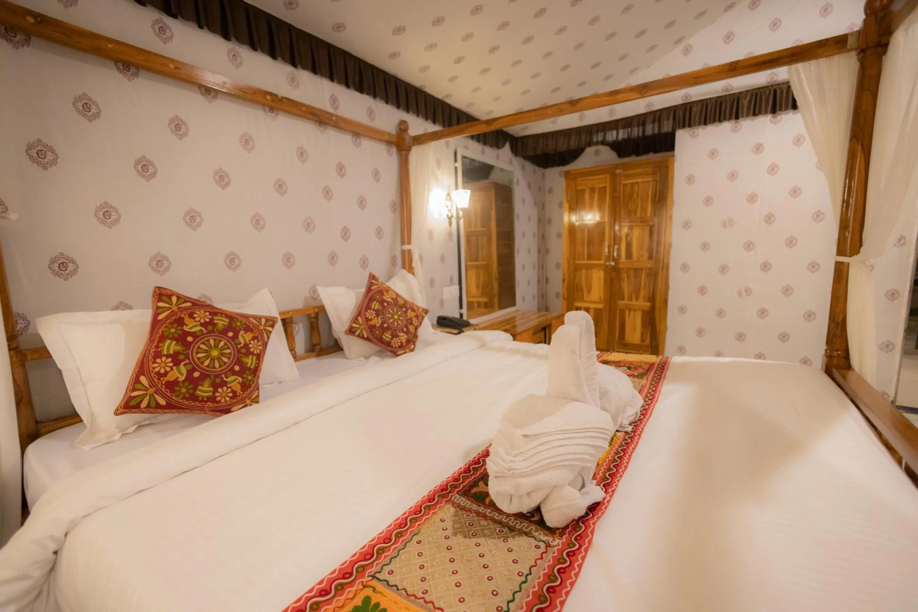 Bed in Vasant Vihar Resort