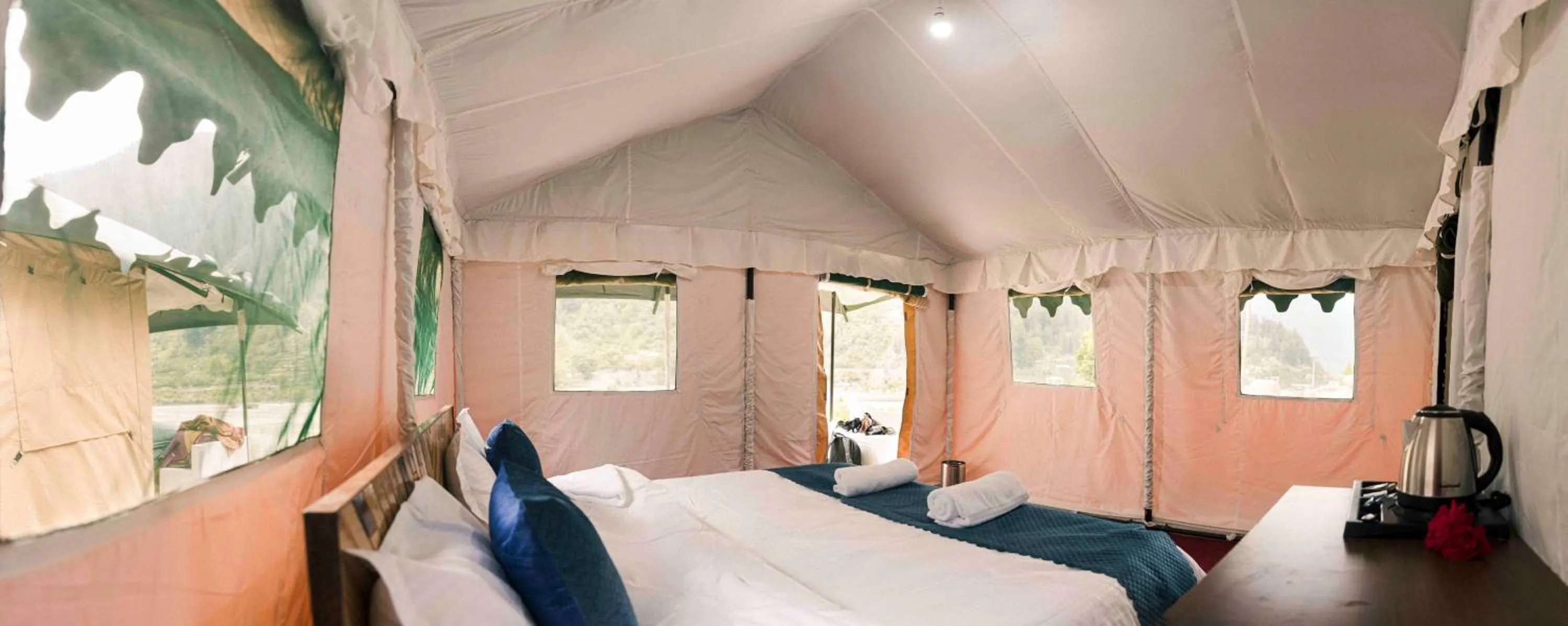 Bed in The Kamru Riverside Camps and Resorts