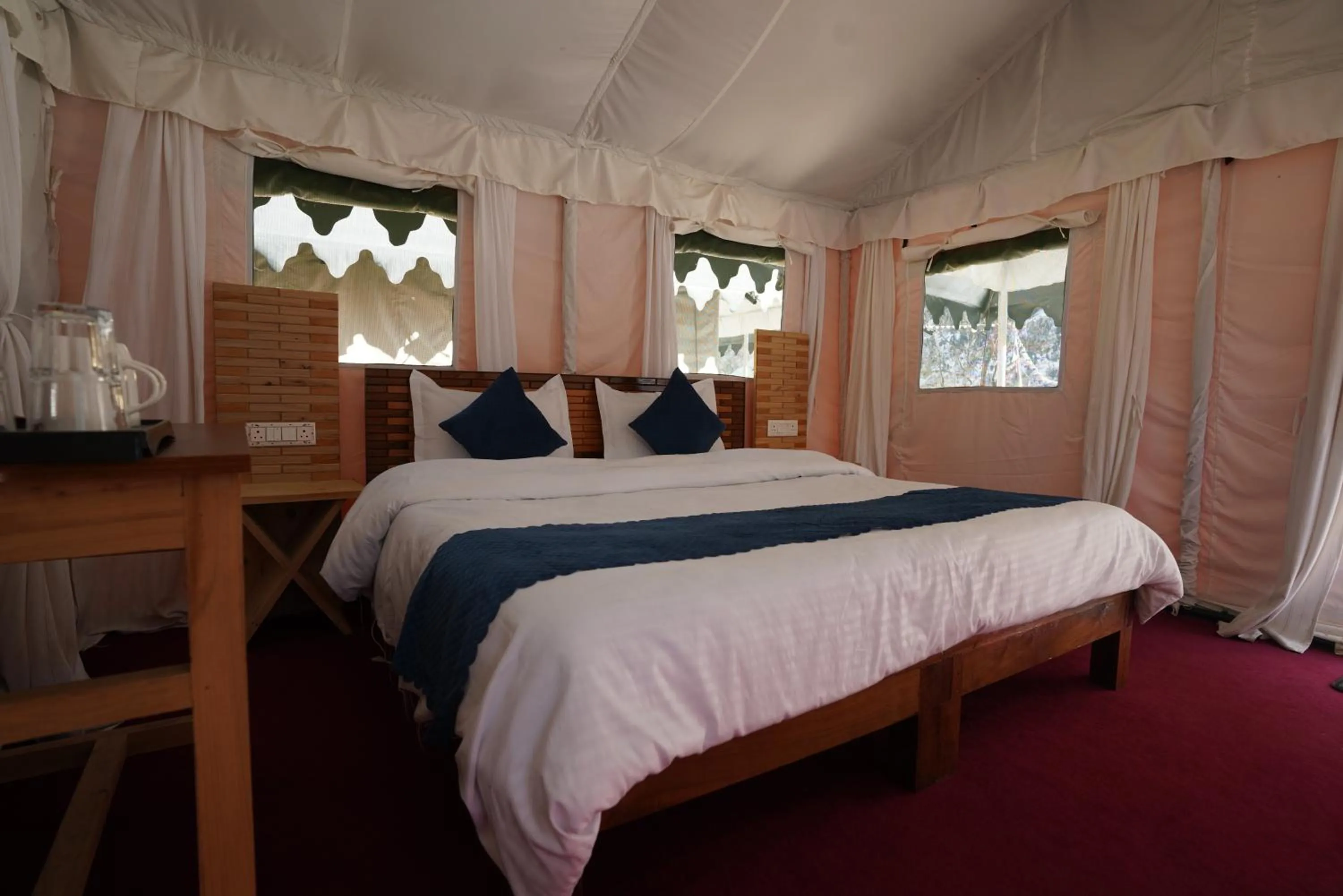 Bed in The Kamru Riverside Camps and Resorts