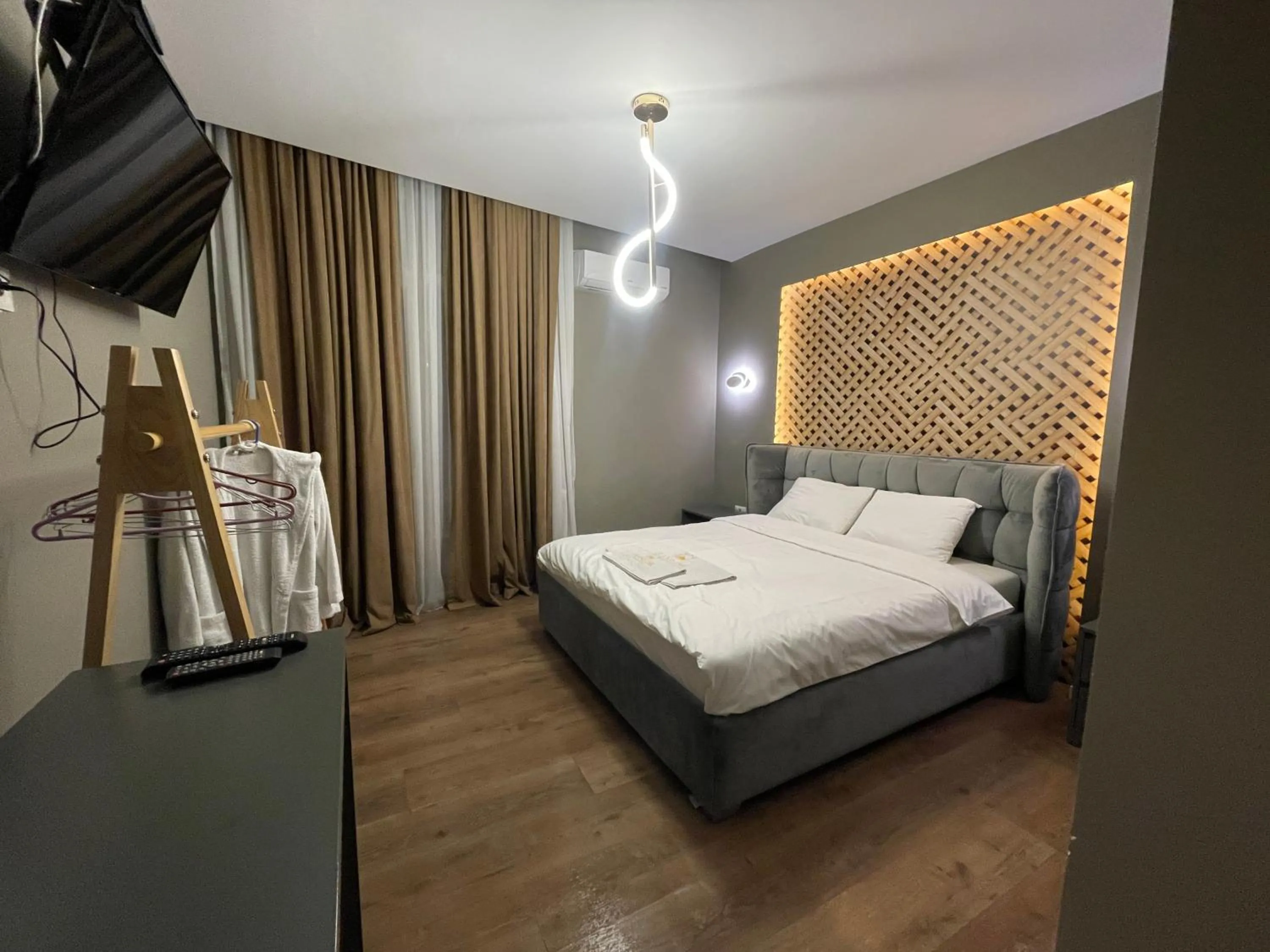 Bed in GRAND JNK Boutique Hotel