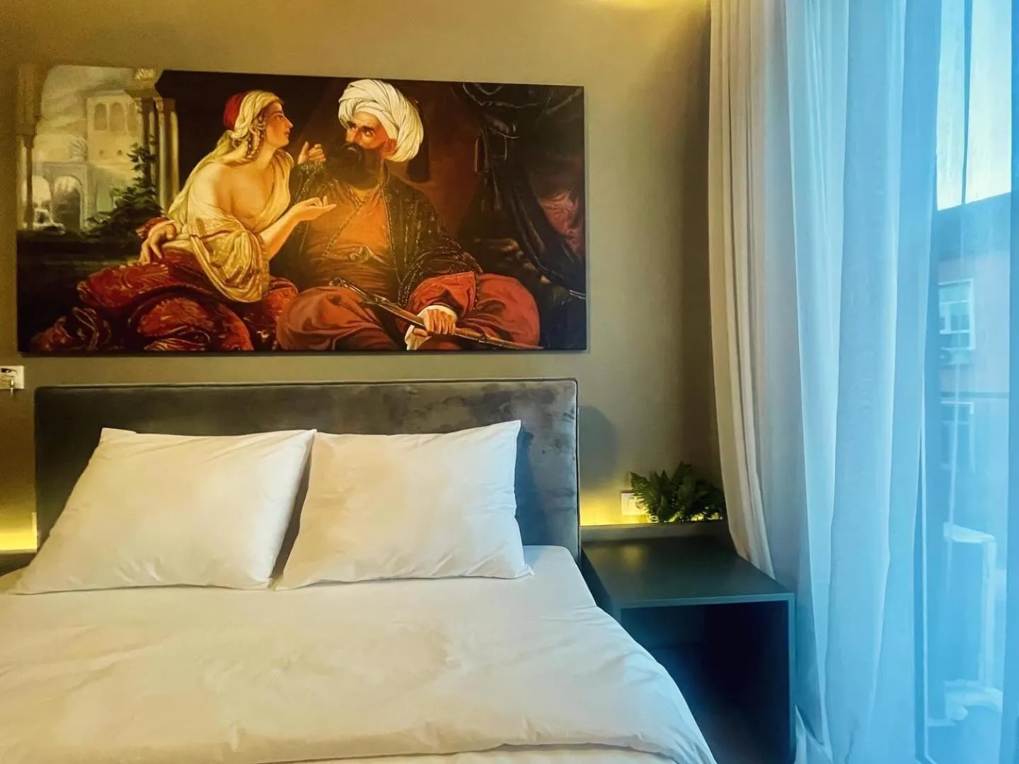 Bed in GRAND JNK Boutique Hotel