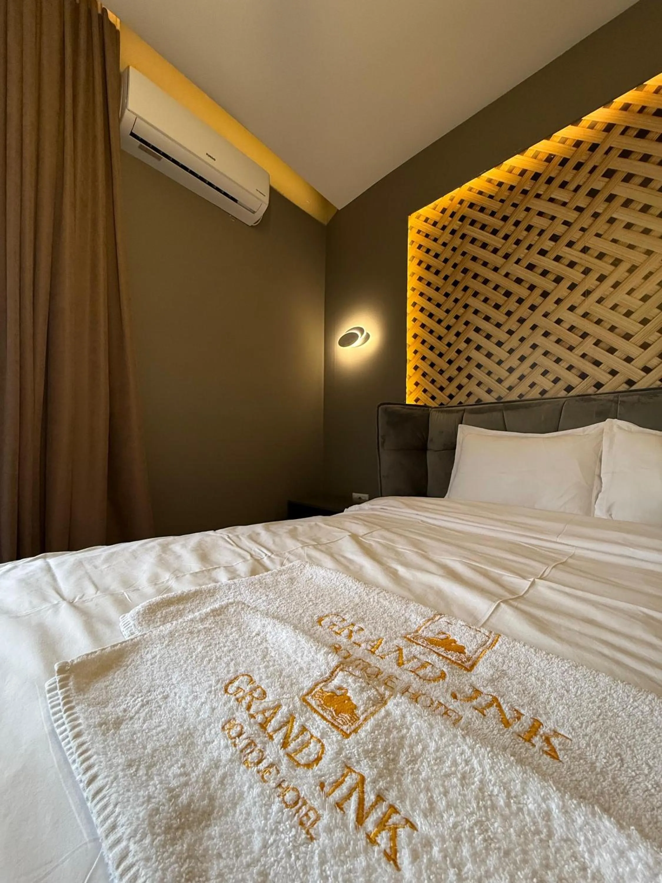 Bed in GRAND JNK Boutique Hotel