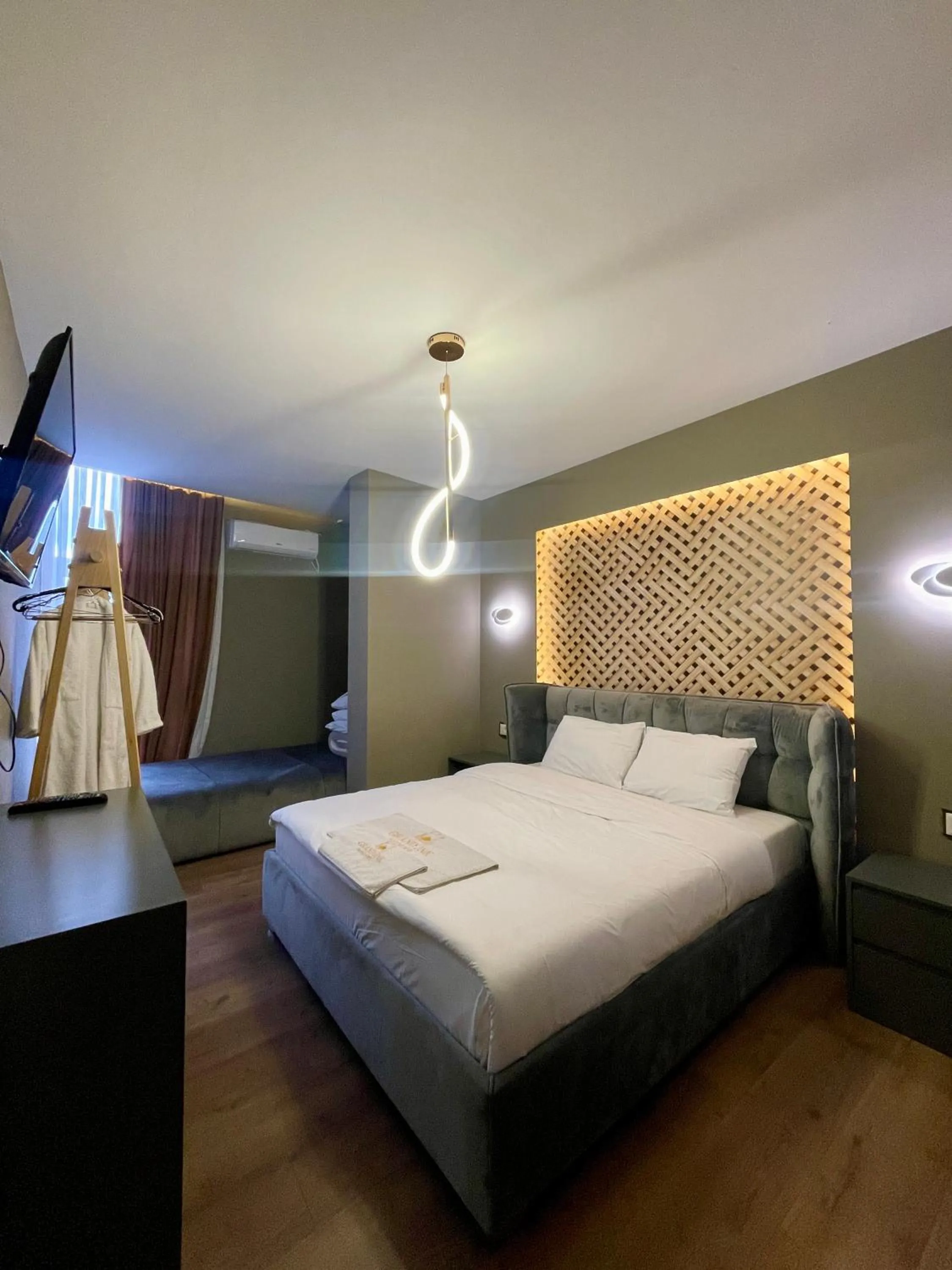 Bed in GRAND JNK Boutique Hotel
