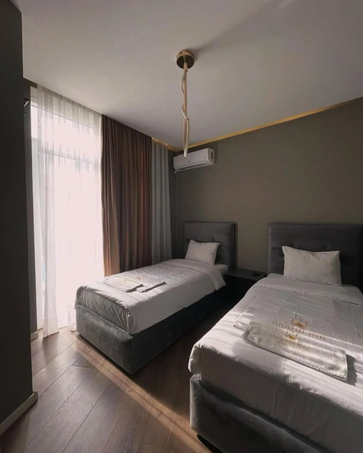 Bed in GRAND JNK Boutique Hotel