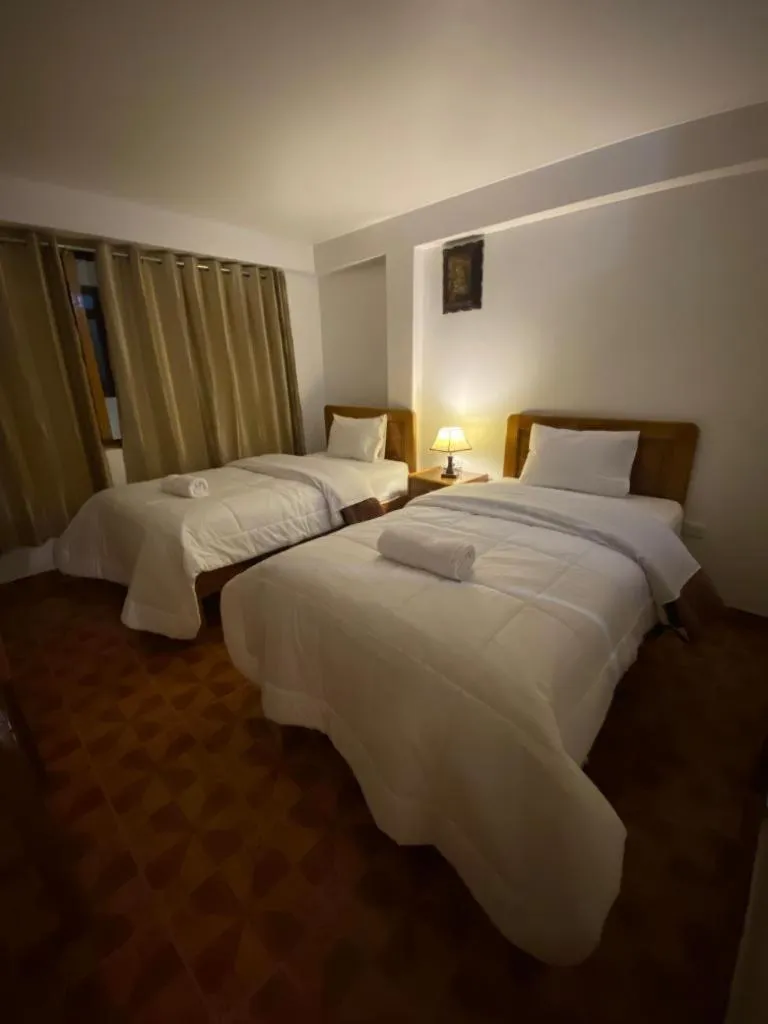 Bed in Inka House Hotel