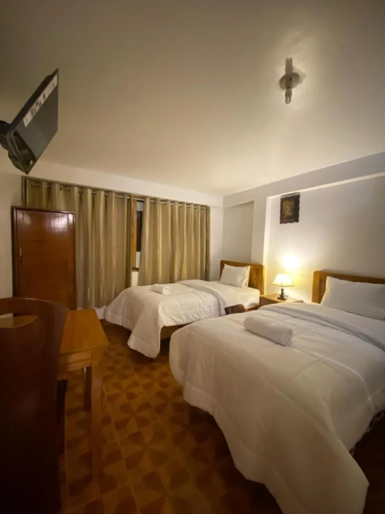 Bed in Inka House Hotel