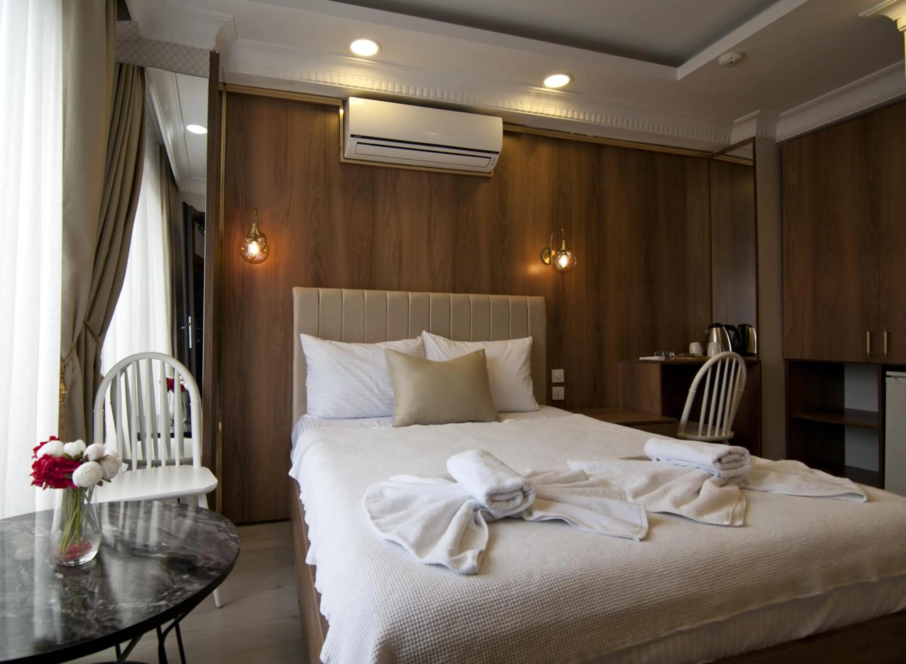 Bed in IMMORTELLE HOTEL