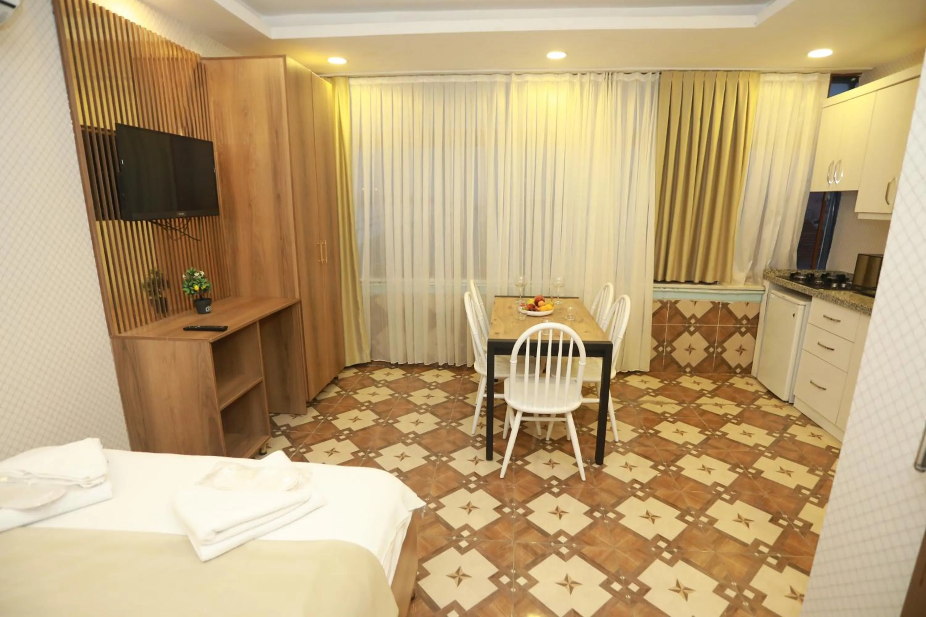 Bed in IMMORTELLE HOTEL