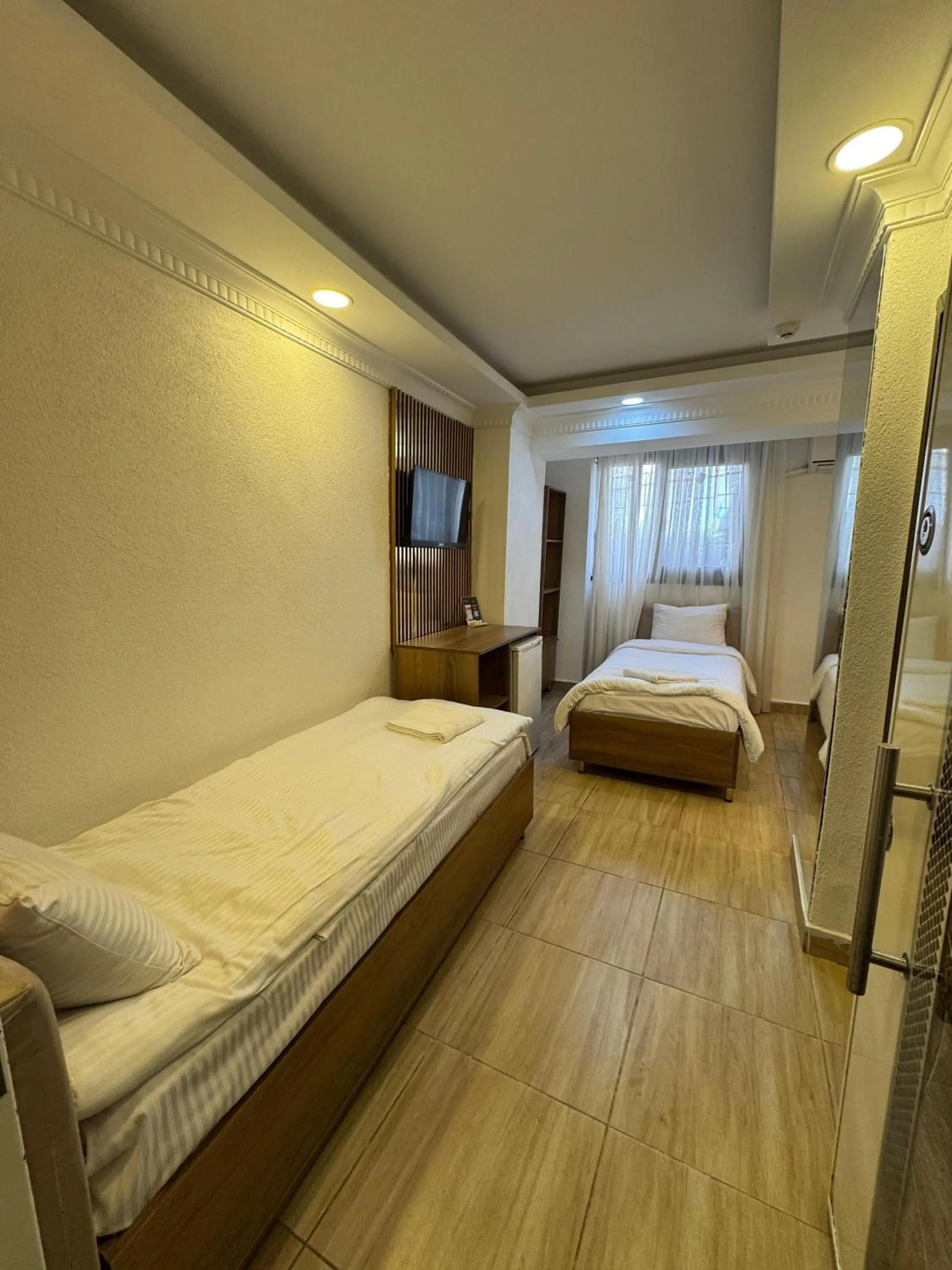 Bed in IMMORTELLE HOTEL