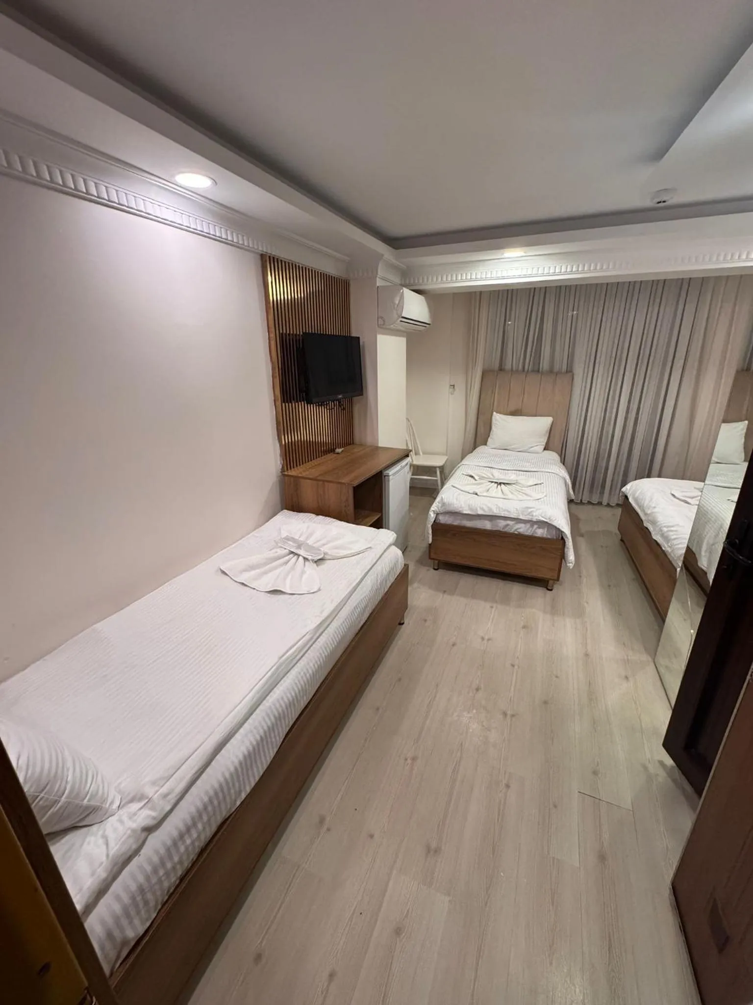 Bed in IMMORTELLE HOTEL