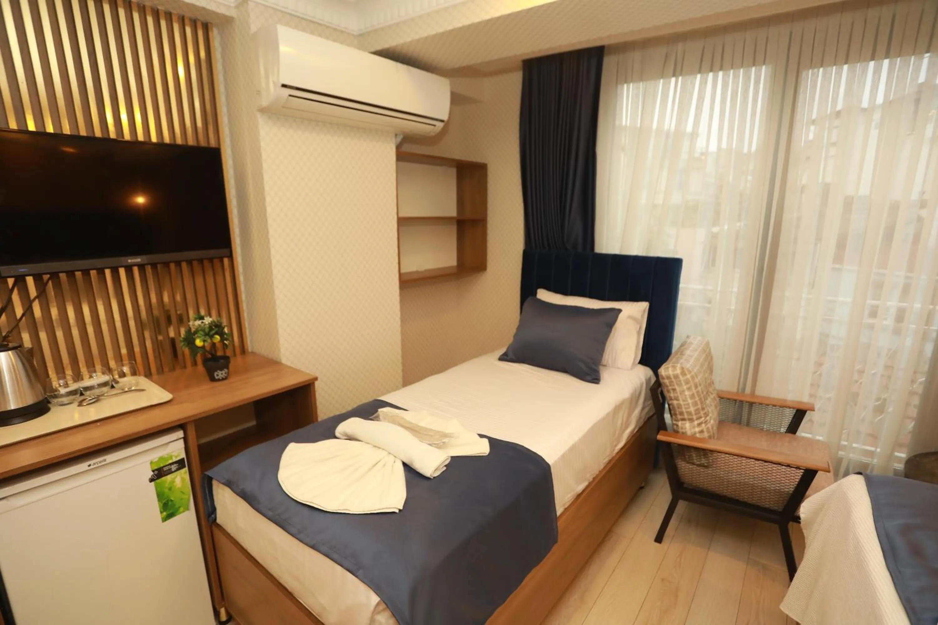 Bed in IMMORTELLE HOTEL