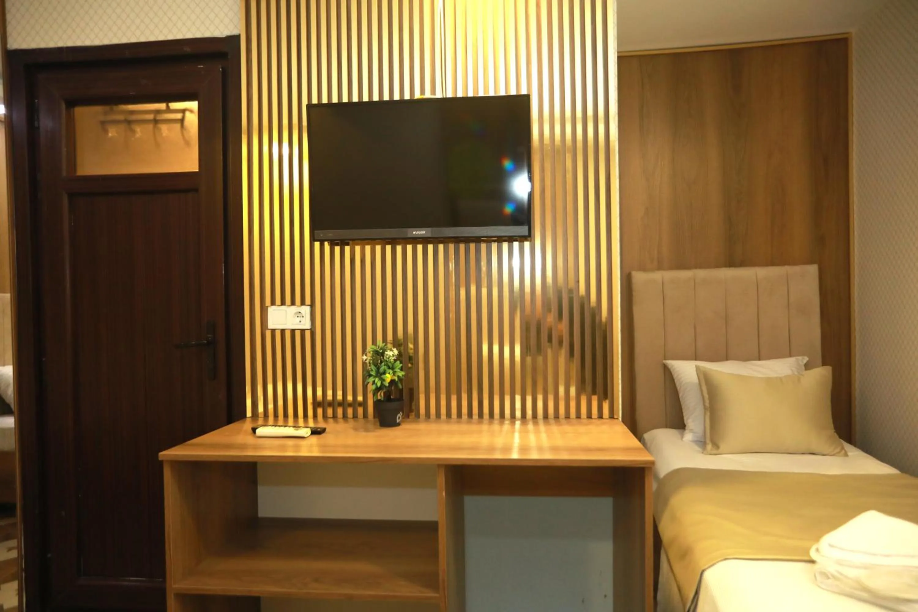 Bed in IMMORTELLE HOTEL