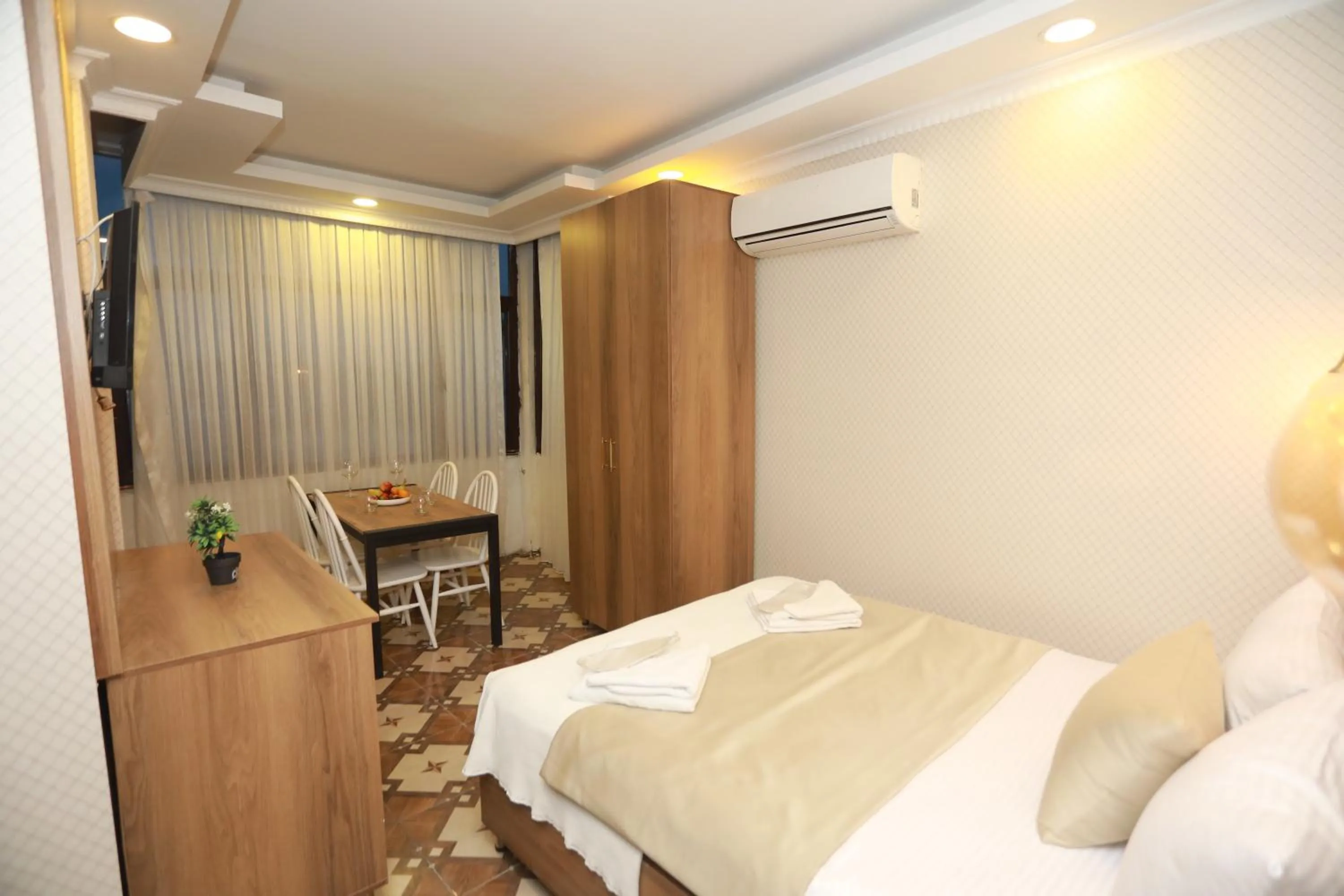 Bed in IMMORTELLE HOTEL