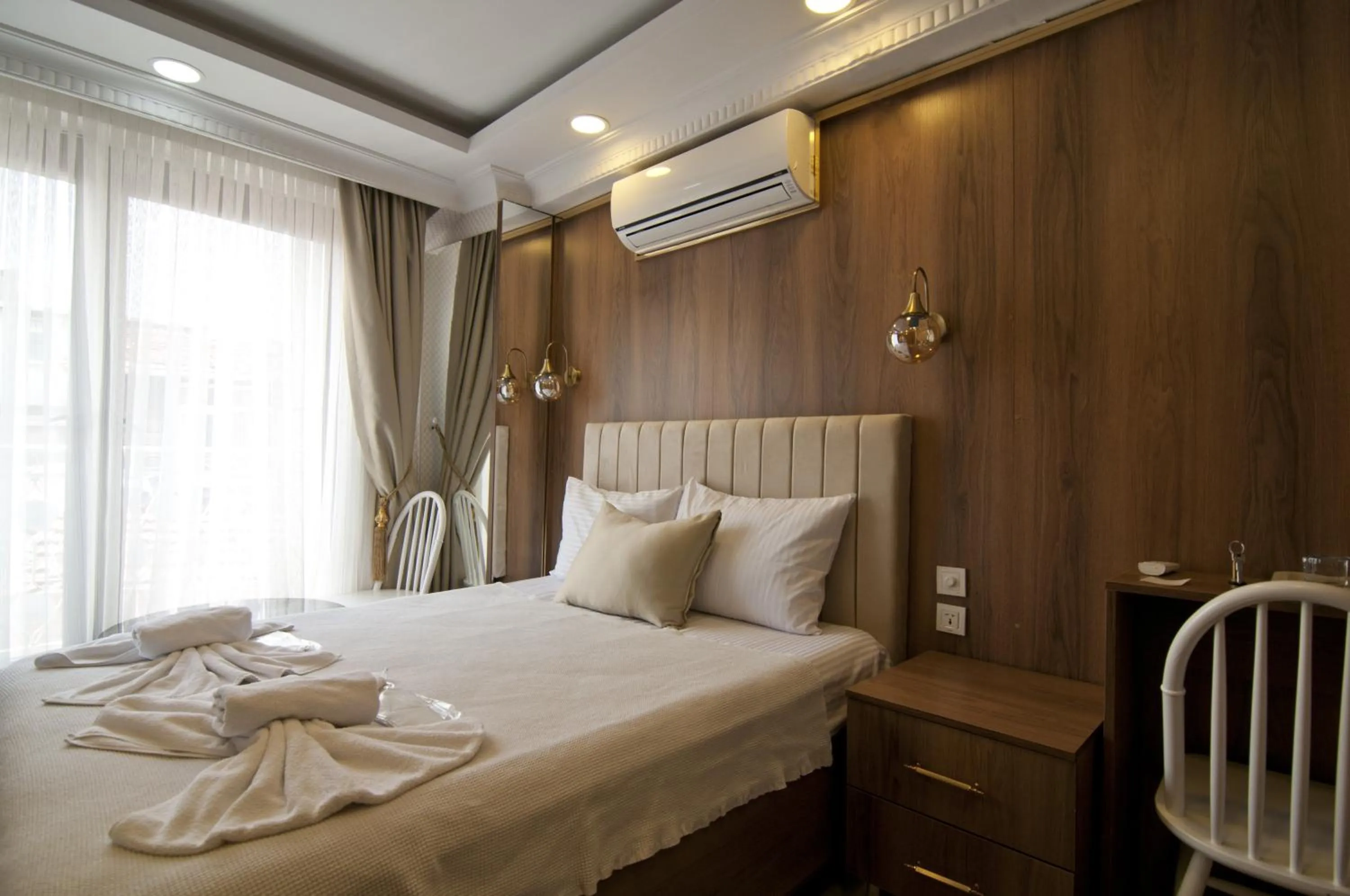 Bed in IMMORTELLE HOTEL