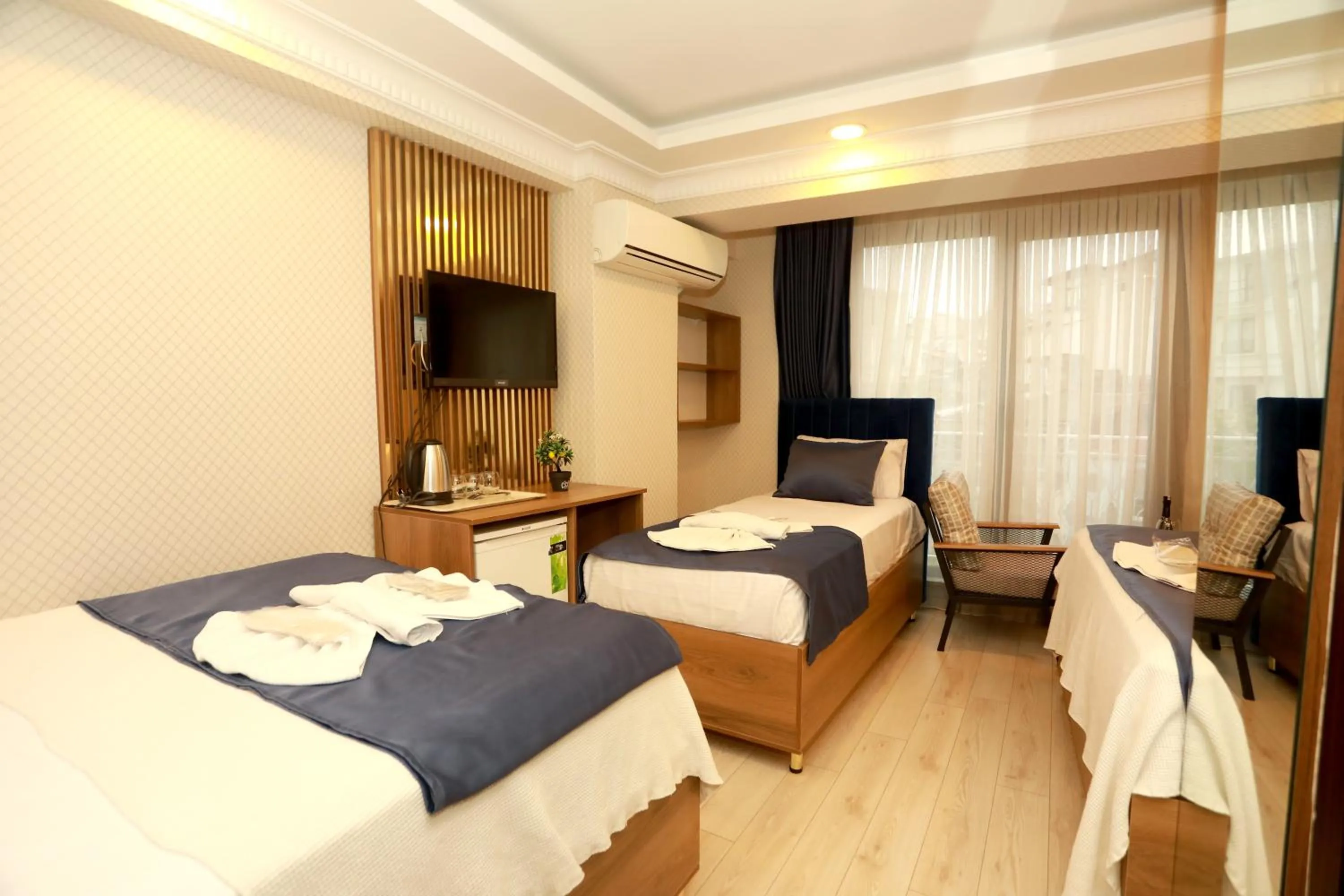 Bed in IMMORTELLE HOTEL