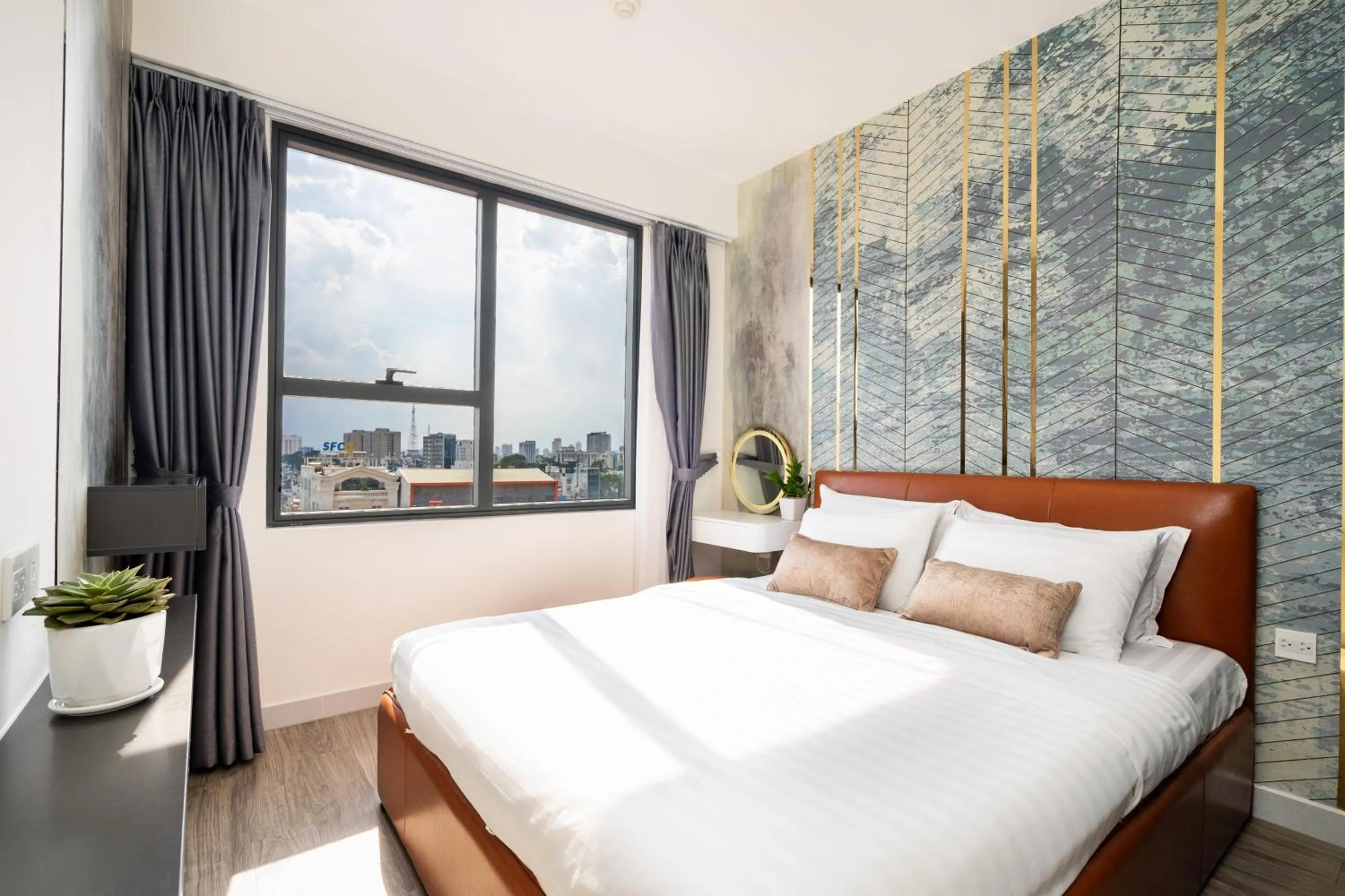 Bed in Otis Soho Saigon Balcony Apartment