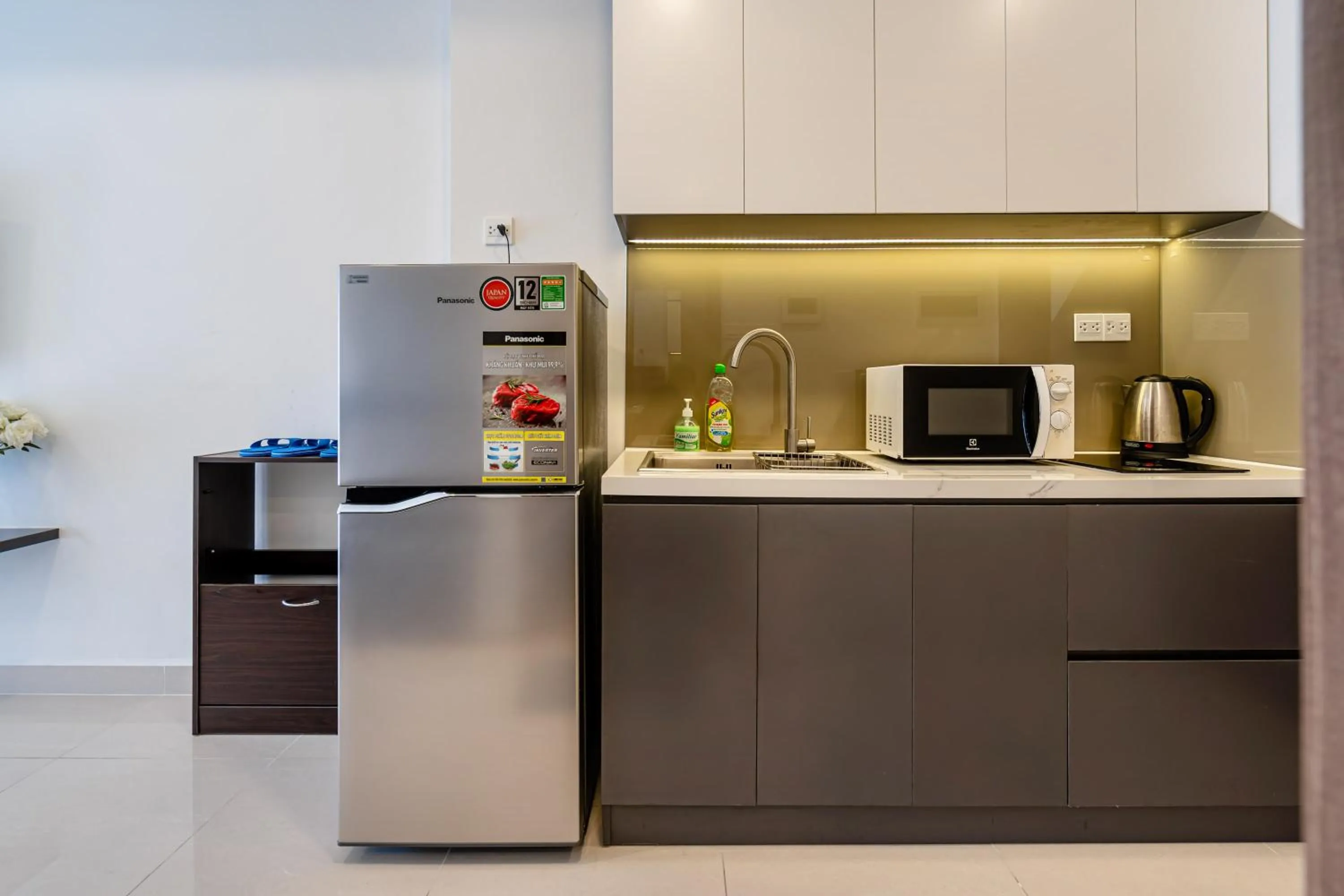 Communal kitchen in Otis Soho Saigon Balcony Apartment