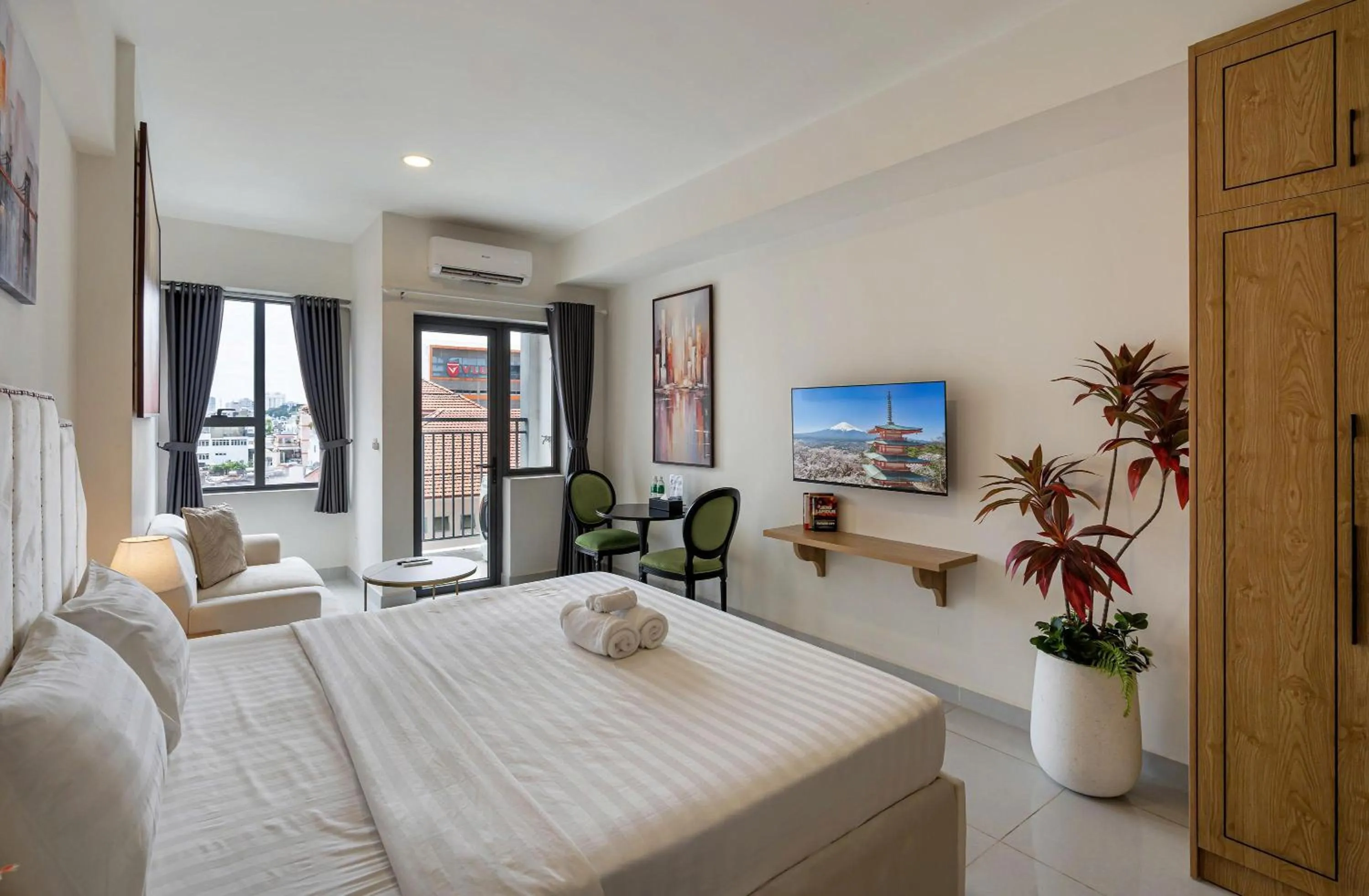 Bed in Otis Soho Saigon Balcony Apartment