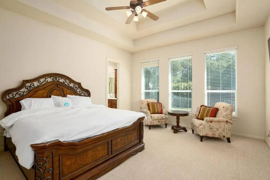 Bed in Bedroom with 3.5-Bathroom near Golf Course!