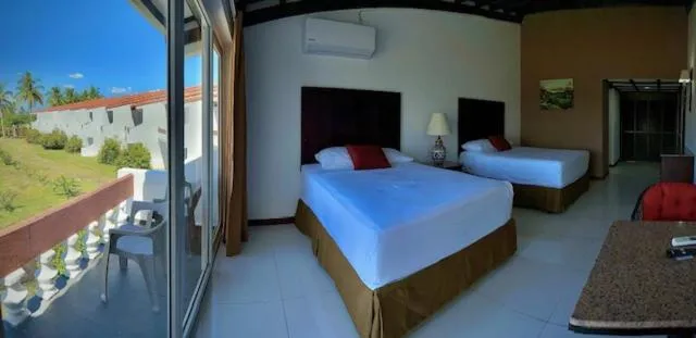 Bed in HOTEL TESORO BEACH