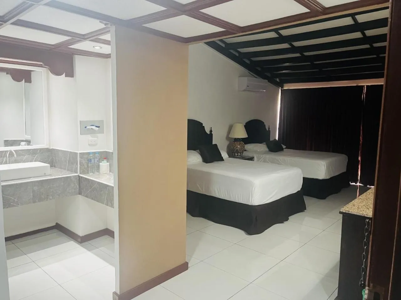 Bed in HOTEL TESORO BEACH