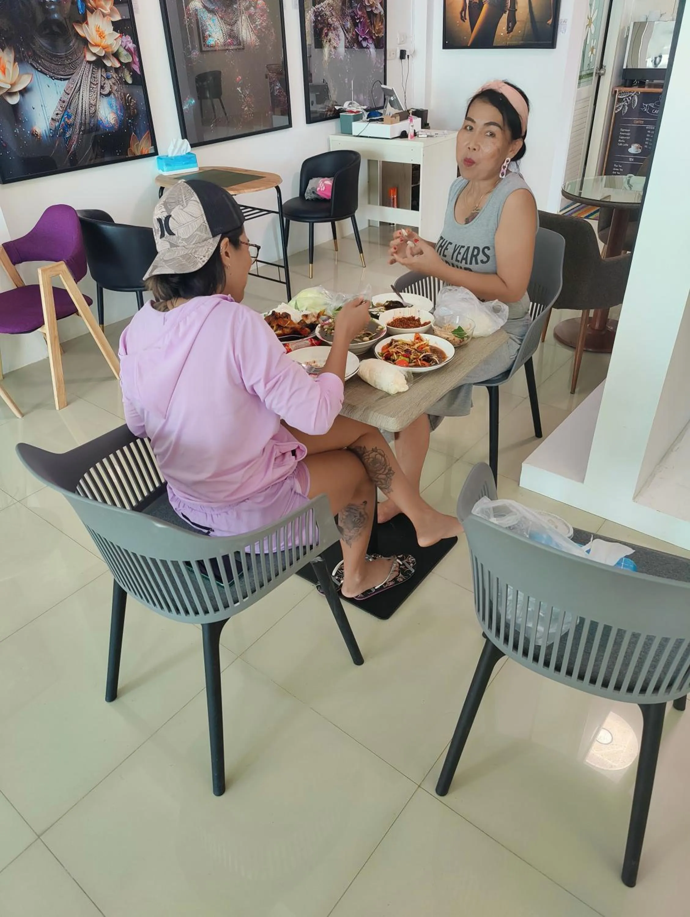 Communal lounge/ TV room in Cafe Nana Hotel