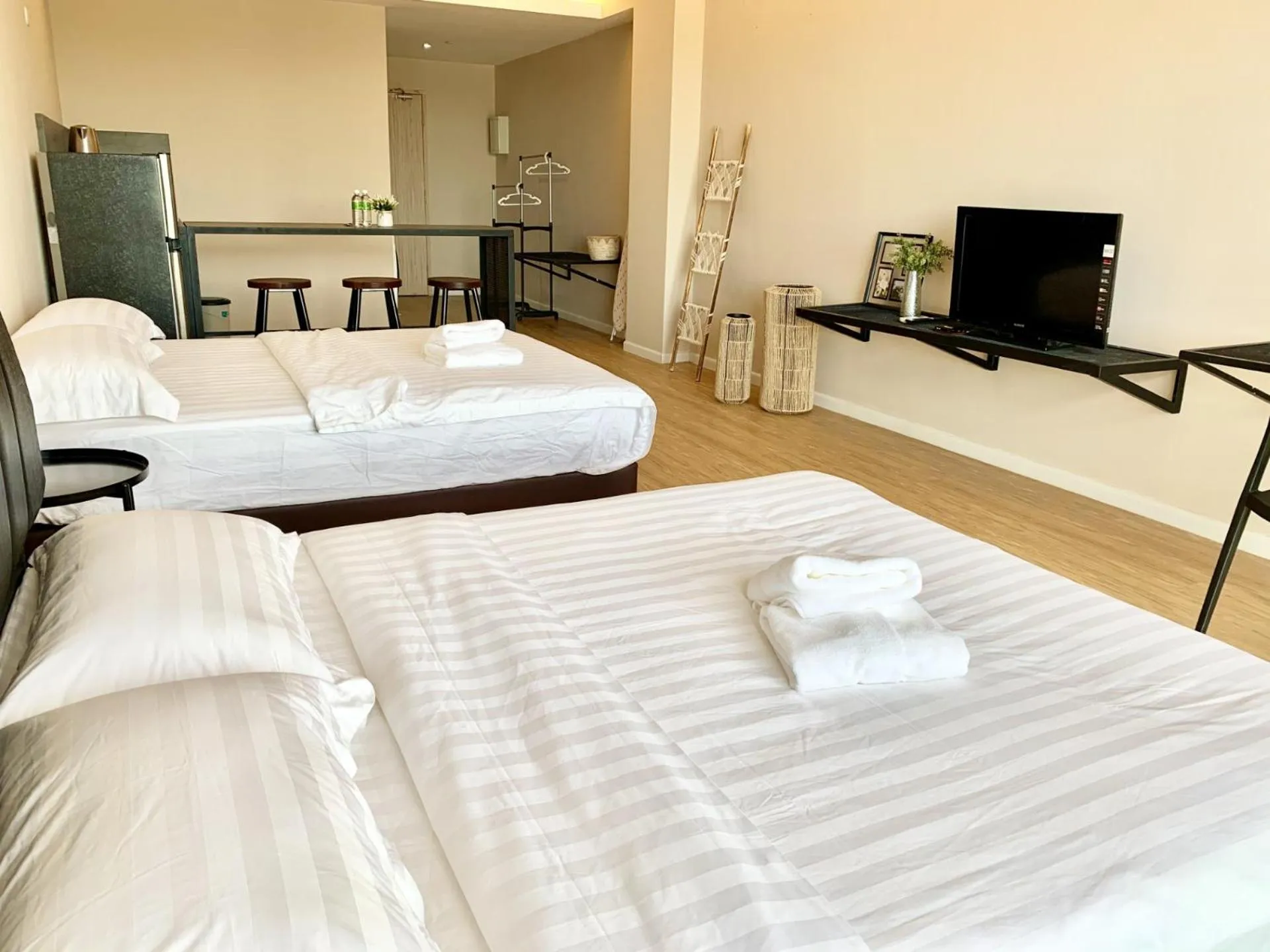 Living room, Bed in Deco Home @ Aru Suites