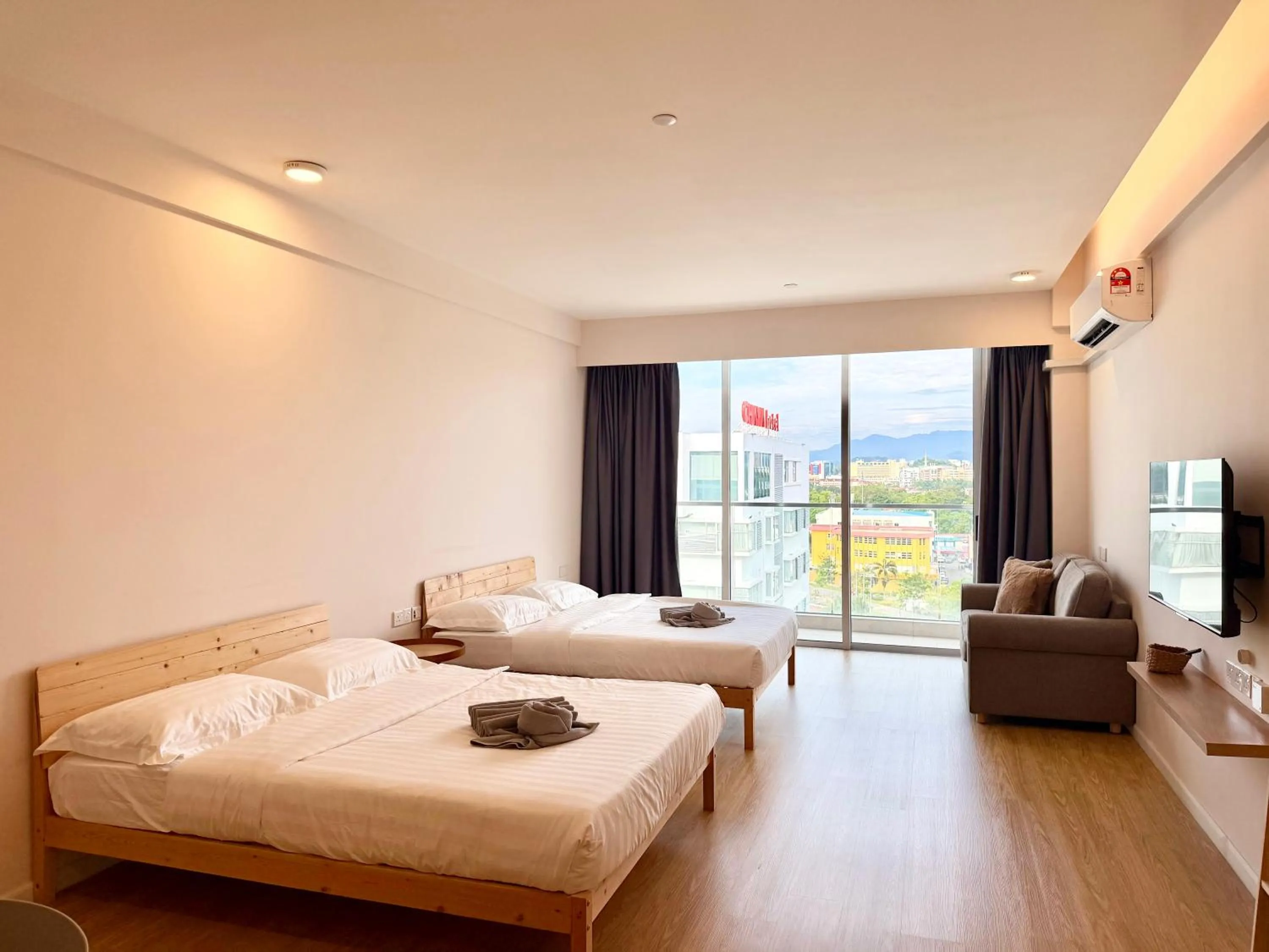 Living room, Bed in Deco Home @ Aru Suites