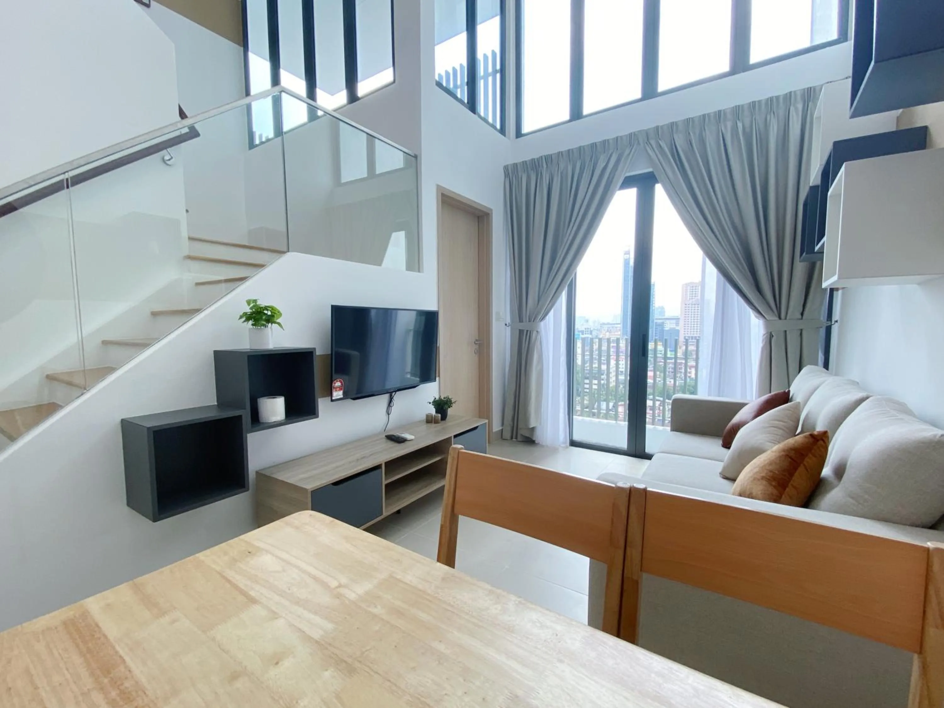 Communal lounge/ TV room in The Colony By Infinitum By Awesomestay