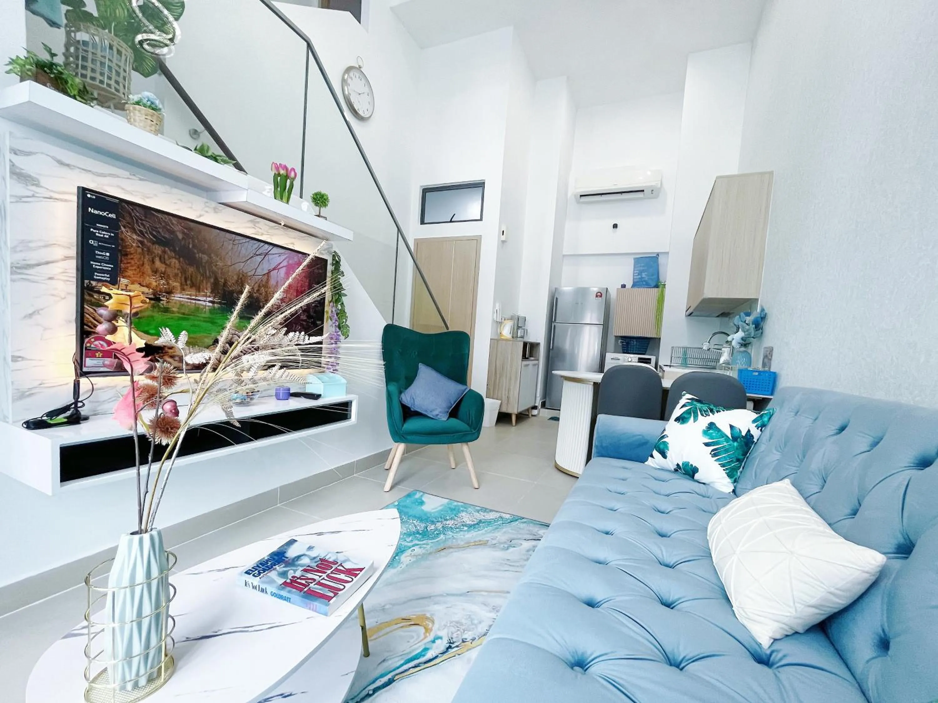 Communal lounge/ TV room in The Colony By Infinitum By Awesomestay