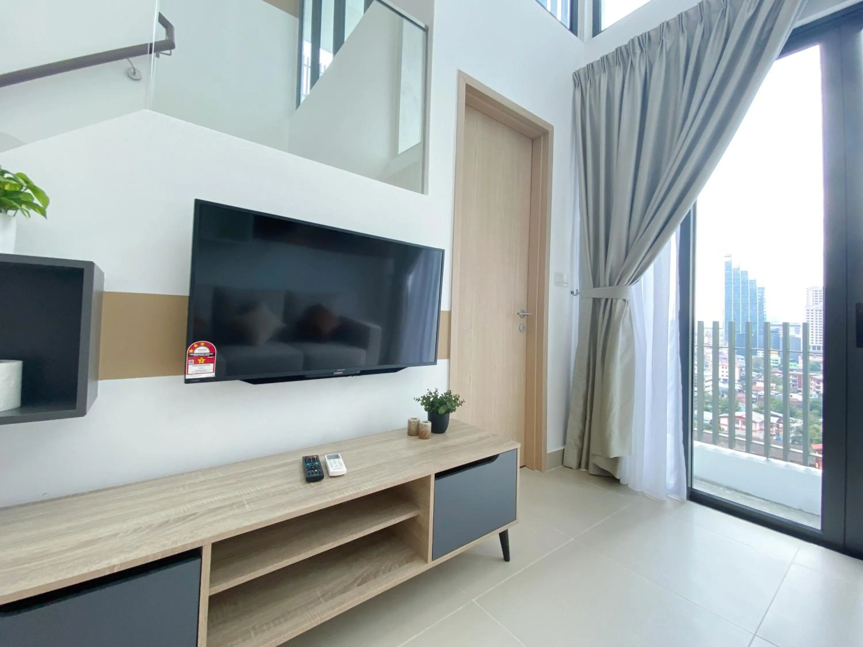 Communal lounge/ TV room in The Colony By Infinitum By Awesomestay