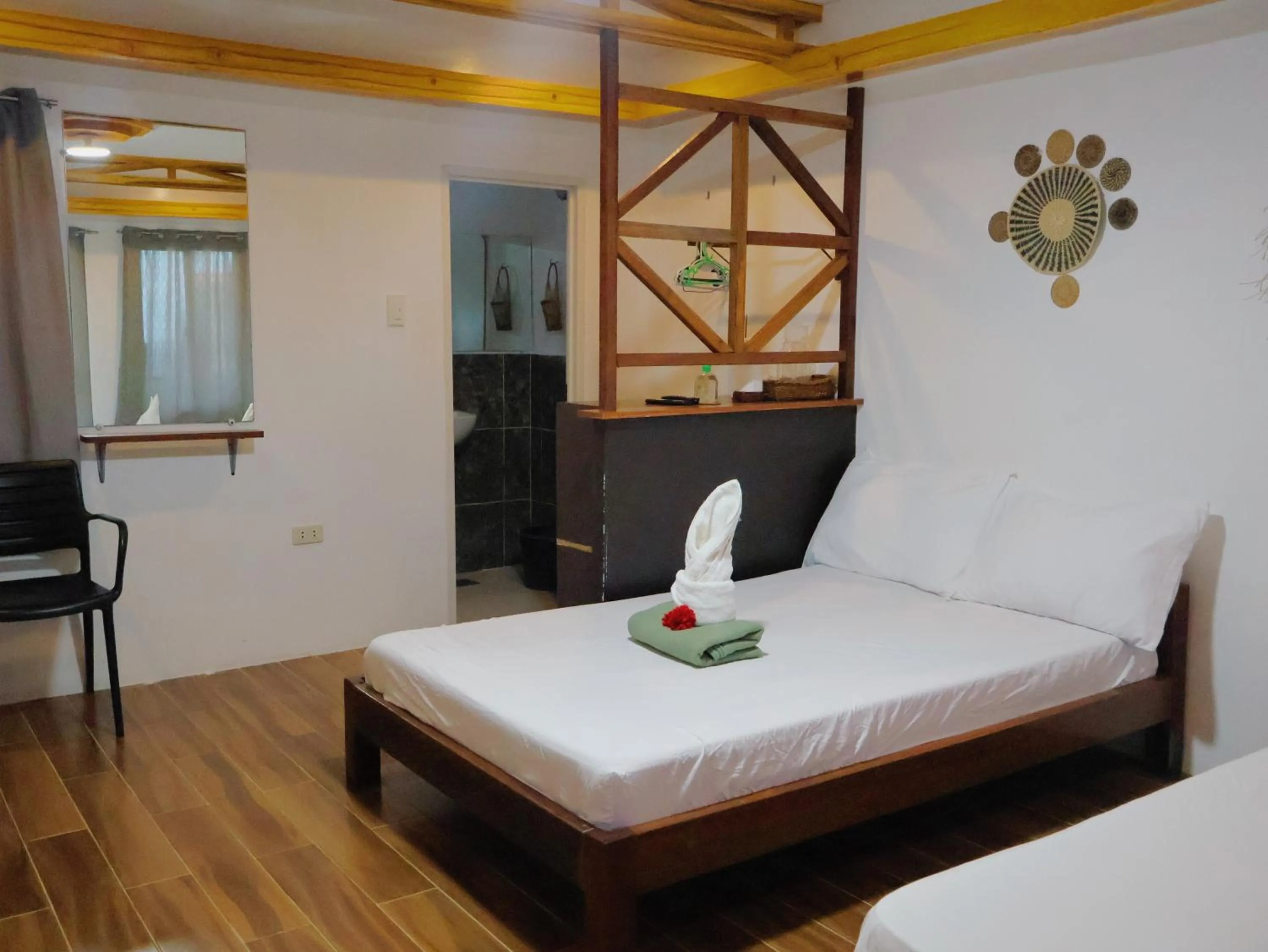 Bed in LANGOJON JIANJOY BEACH RESORT