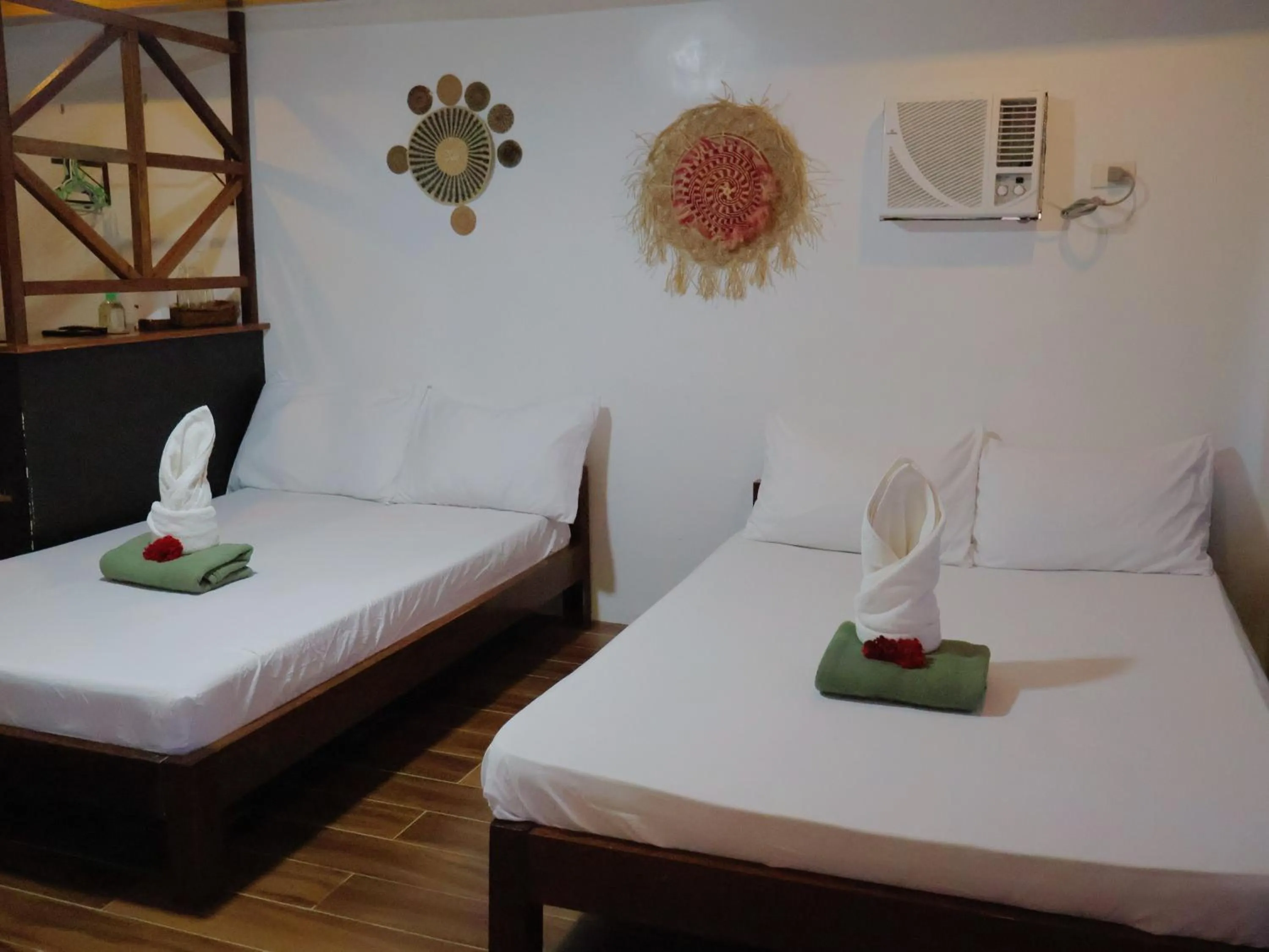 Bed in LANGOJON JIANJOY BEACH RESORT