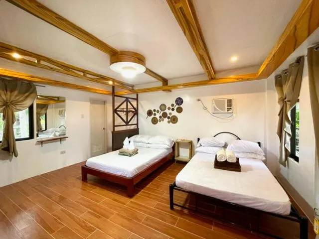 Bed in LANGOJON JIANJOY BEACH RESORT