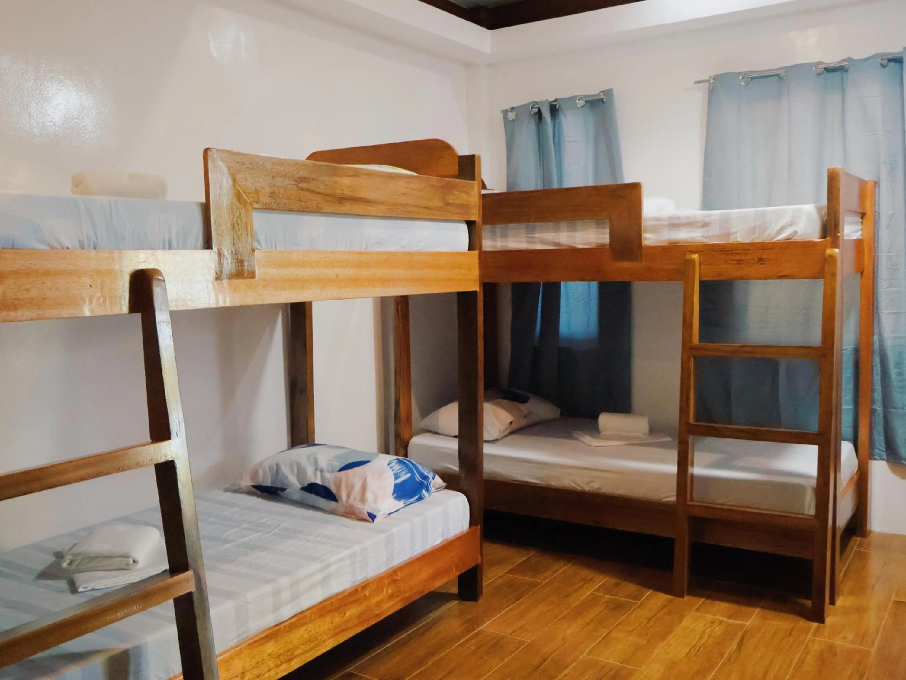 Bed in LANGOJON JIANJOY BEACH RESORT