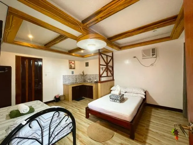 Bed in LANGOJON JIANJOY BEACH RESORT