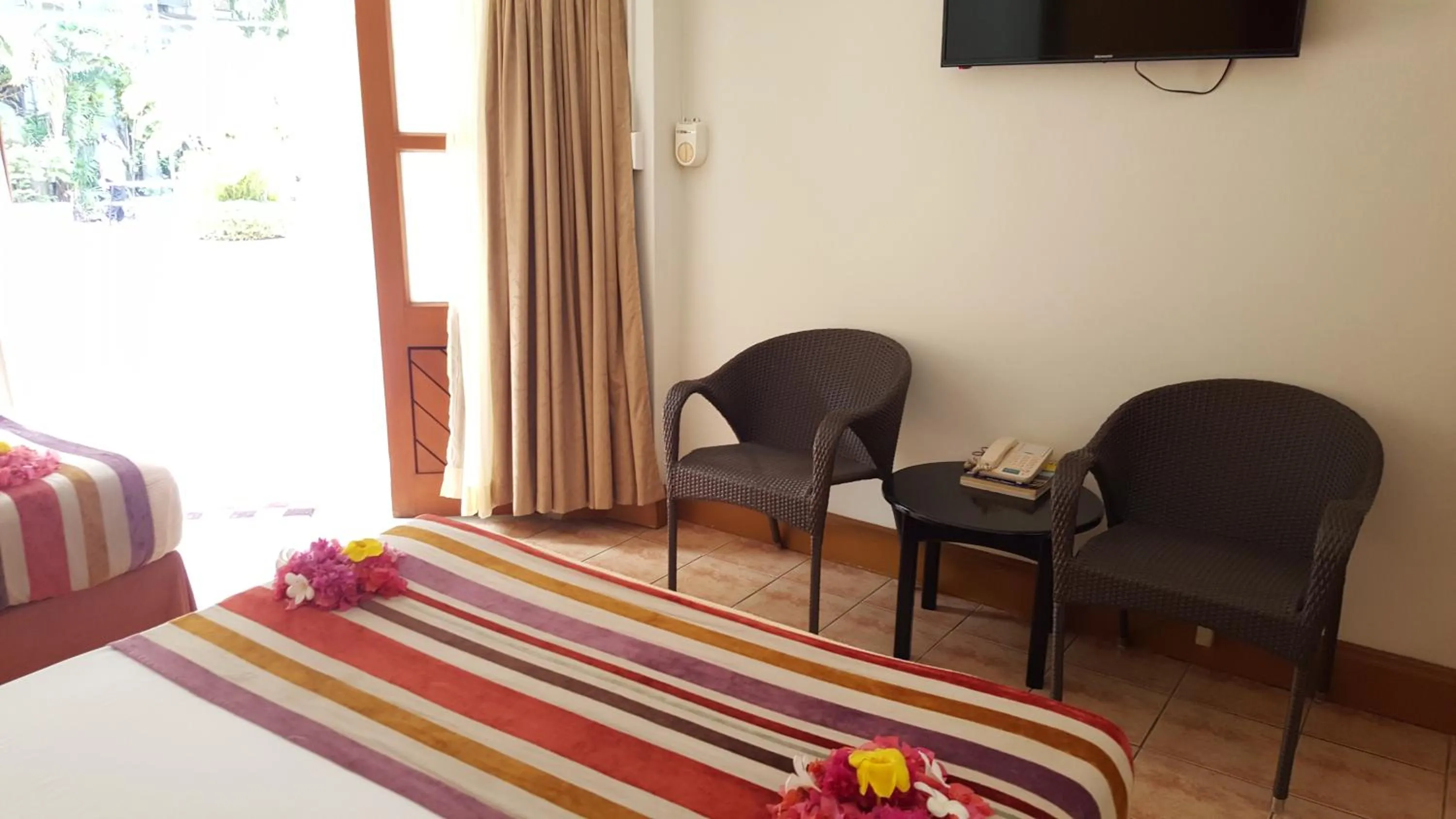 Bed in Hexagon International Hotel, Villas & Spa